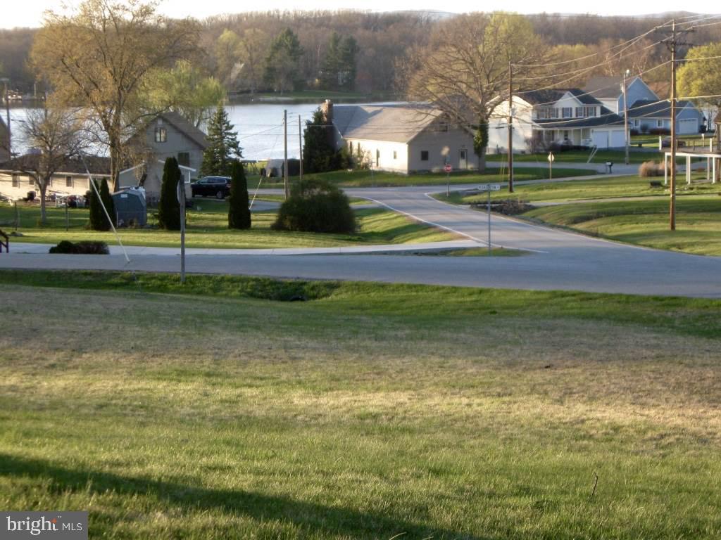 BEAUTIFUL VACANT LOT AT LAKE MEADE! Enjoy a view of the Lake! Build your custom home on this spacious 0.57 acre vacant lot in the gated community of Lake Meade. Lots of great amenities to enjoy while you live by the lake - Swimming Pool, Tennis Courts, Boating, Restaurant, Marina Playground, Fire Company.