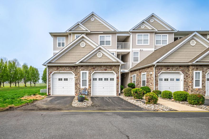 Welcome to effortless first floor living in the sought after Hearthstone Manor community. This beautifully positioned end unit offers the perfect blend of privacy and convenience with no steps and serene green lawn views right outside your door. Inside you will find a thoughtfully designed layout featuring two spacious primary suites, each with its own private bathroom, ideal for guests, roommates, or flexible living. The open living area flows seamlessly to a screened in porch, creating the perfect space to enjoy your morning coffee or unwind with dinner outdoors.This home also offers a one car garage plus a private driveway parking space, a valuable feature in the community. Just a short walk away, enjoy access to the community outdoor pool for easy summer relaxation. Major systems have been meticulously maintained including a new HVAC system installed in December 2025, recently serviced in March 2026 and under warranty, along with a water heater that is just four years young, offering peace of mind for years to come. The home is also connected to public water and sewer. The owners are building new construction with an expected completion date of August 2026. New owners will need to either wait until that time for occupancy or be open to a seller rent back arrangement. Don’t miss your opportunity to own one of the most desirable layouts and locations in Hearthstone Manor.