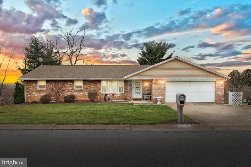 Incredible Brick Rancher with ""Full  In-Law Quarts with separate entrance!!!""  The main level features: a large living room with a picture window, Formal Dining Room , First floor family room with brick wood burning fireplace with a gas line for future gas logs, a Large Eat in Kitchen with solid surface counter tops, Tile back splash, a large pantry closet, and all appliances.  Down the hall, you will find the hall bath with tile floor, two nicely sized bedrooms, and the primary suite.  The primary bath features tile floor, oversized tile shower, and an LG washer and dryer.  The entire first floor of this home is plank flooring.    The two car front load garage is home to the stairway leading to the walk up attic.    Descending to the basement you will be greeted by a large Rec Room, a 10 X 12 Storage Room,  A laundry Room, a workshop with a work bench and shelving, and a second set of living quarters featuring:  a 13X 18 Eat in Kitchen with hardwood floors, granite countertops, all appliances, and a pantry closet.  Down the hall, you will find a full bathroom with Tile flooring, and a  large bedroom.  Off the kitchen there is a sliding door to the 12 X 29 Sunroom that is heated and cooled with a Mini Split system.  Off of the sunroom is a large stamped concrete patio over looking the fenced yard with a shed.   Other features include:  a large concrete driveway for up to 6 cars, corner lot, Architectural shingle roof, Gas Heat, CAC, Fenced yard, Full walk out basement, convenient location, minutes from I-83, and much more.   This is truly a hard to find property.