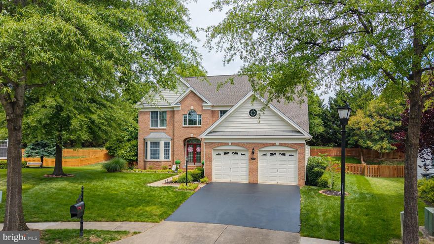Immaculate Arlington model tucked away on a quiet cul-de-sac in the gated golf course community of Dominion Valley Country Club! Situated on a private .24-acre lot backing to mature trees and common area, this beautifully updated home offers over 4,600 square feet of elegant living space, exceptional outdoor entertaining, and incredible value. A dramatic two-story foyer, hardwood flooring, solid wood stairs with wrought iron spindles, and extensive custom molding create an impressive first impression. The updated gourmet kitchen features granite countertops, newer GE Profile stainless steel appliances, gas cooktop, and opens seamlessly to the spacious family room with gas fireplace. The oversized primary suite offers a sitting room and two walk-in closets with custom closet systems. The finished lower level is ideal for entertaining with a granite wet bar, full-size refrigerator, spacious rec room, full bath, and large storage room. Outdoor living shines with an expansive maintenance-free deck, stamped concrete patio with seat wall, and fully fenced backyard — perfect for entertaining or relaxing in total privacy. Additional highlights include a brand new roof, new main-level HVAC, EV charger, and irrigation system. Enjoy Dominion Valley’s resort-style amenities including indoor and outdoor pools, golf course, clubhouse, fitness center, tennis courts, trails, and more. World-class amenities include an Arnold Palmer Signature golf course, renovated clubhouse, state-of-the-art Sports Pavilion, five swimming pools including an indoor pool, tennis and basketball courts, playgrounds, miles of walking and biking trails, and two fishing ponds.
Award-winning schools!