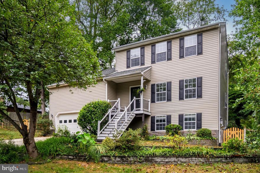 Welcome to your dream home nestled in a park-like setting! The beautifully updated home boasts fresh new paint and flooring throughout. The spacious main level includes a living room, dining room, family room, and half bath. The heart of the home features a brand new kitchen, equipped with state-of-the-art appliances, sleek countertops, and abundant cabinetry with undermount lighting. Cooking and entertaining have never been easier or more enjoyable! The composite deck is just steps away and the perfect spot to grill.

The upper level encompasses a primary suite with vaulted ceiling and attached bath. There are two guest bedrooms and a hall bath, providing ample space for family and guests.

The lower level is a hidden gem, boasting a comfortable 4th bedroom and a full 3rd bath, perfect for an in-law or au pair suite. This private space offers flexibility and convenience for multigenerational living or guests. In addition there is a room that could be a game room or home theater.

Set on a generous .86-acre lot, this property is a nature lover's paradise! Enjoy your own orchard with fruit trees, including pear and plum, as well as a bounty of blackberries, blueberries, and raspberries. The lush landscape invites outdoor gatherings, playtime, or simply moments of tranquility.

 A standout feature is the expansive 50-foot carport, ideal for storing your boat or RV. Enjoy the freedom to explore the great outdoors without worrying about where to park your toys!

Located in the highly desirable  water privileged community of Bon Haven. The voluntary community association members have access to a pier, slips, and a boat ramp, making waterfront activities easily accessible. Imagine spending weekends on the water, fishing, or simply soaking in the sun! Currently, boat slips are available starting at just $300 per year.

Despite its secluded feel, this home is perfectly positioned for an easy commute to Washington D.C., Ft. Meade, Baltimore, or the Naval Academy. Enjoy the tranquility of suburban living with all the conveniences of city life just minutes away!