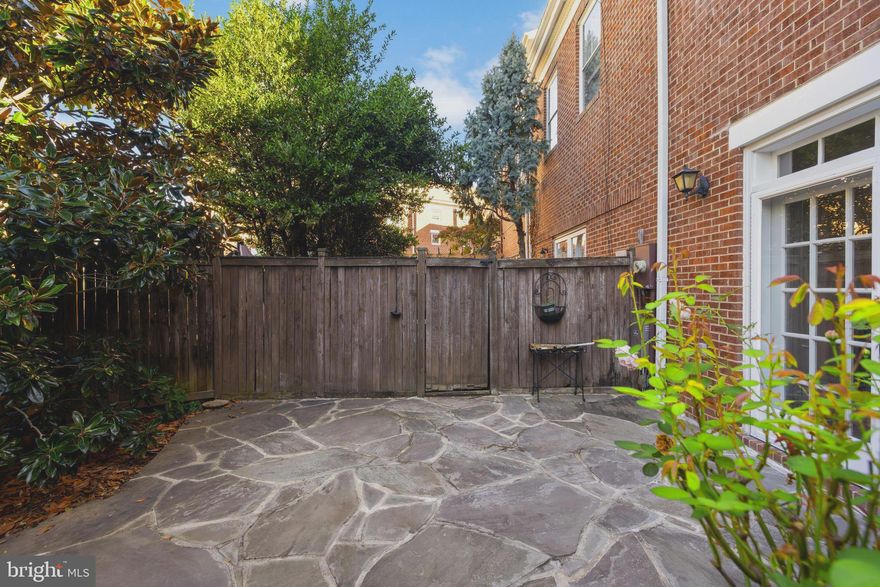 Welcome to this beautifully maintained end-unit brick home, perfectly blending classic and modern conveniences. The ideal location offers a short walk to the Metro and the incredible convenience of off-street parking. Inside, you'll discover a thoughtfully designed layout: Main Level: Enter into a warm space with gleaming hardwood floors. The kitchen has ample storage and counter space great for entertaining. The dining area features a charming step-down into the spacious family room, creating a distinct yet open flow. This cozy room is anchored by a fireplace and looks out onto your private patio and garden. An added Convenient powder room on the main level is perfect for guests. Second Floor: The upper level is dedicated to rest and relaxation, featuring two spacious bedrooms and two full bathrooms. The convenience of an upper-level laundry completes this floor. Third Floor Flex Space: The top level offers a fantastic, large bonus room. This versatile space is perfect for a home office, a playroom, a spacious primary suite retreat, or a guest room—the possibilities are endless. Summary of Key Features: End-Unit with Extra Light & Privacy, Off-Street Parking, Walk to Metro, Hardwood Floors & Cozy Fireplace, Fantastic Kitchen, Family and Dining Rooms, Private Patio/Garden, Main-Level Powder Room, 2 Bedrooms, 2 Full Baths, 2nd-Floor Laundry, 3rd-Floor Bonus Flex Room. This move-in ready home offers the perfect combination of urban convenience and private outdoor space. Don't miss this rare opportunity! UPDATES AND REPAIRS. NEW HOT WATER HEATER 2019, WINDOW RESTORATION AND EXTERIOR PAINTING 2018, NEW HVAC 2010, NE WHVAC MOTOR 2019, 2 UPSTAIRS BATHROOM UPDATES 2019, NEW REGRIGERATOR 2019.