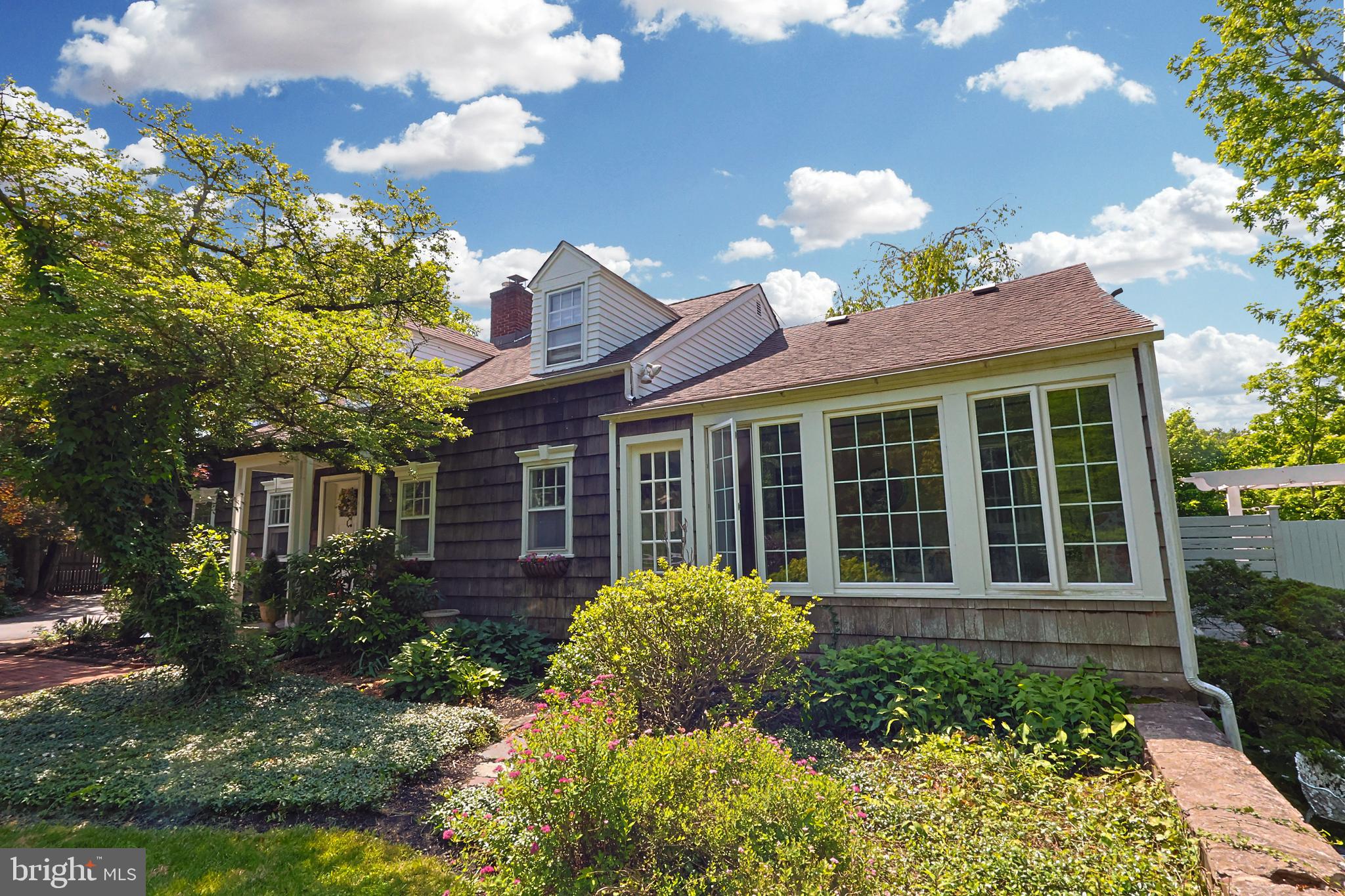 OPEN HOUSES: Fri 6/27 6-8pm, Sun 6/29 12-2pm | PLEASE NOTE: The primary residence features 4BR and 3BA and showcases all the exceptional amenities outlined in the listing. As an added bonus, a separate apartment—connected to the garage—offers its own kitchen, full bath, living room, loft-style bedroom, private patio, and dedicated entrance—perfect for guests, extended family, a home office, or private studio.
<-------> Welcome to this beautifully updated 4-bedroom, 3-bathroom Cape Cod home nestled on the tranquil banks of Mill Creek. Set on a large, private lot, this charming home offers the perfect blend of peaceful living and modern convenience.
<-------> Inside, the main living areas feature hardwood floors, abundant natural light, a stone fireplace, and stylish updates throughout... all set within a thoughtful flowing layout. The heart of the home is the modern kitchen, offering quartz countertops, stainless steel appliances, and views of the expansive backyard and creek beyond. The first floor is capped off with a private bedroom and full bathroom providing flexibility for guests or convenient one-level living.
<-------> Step outside to your backyard oasis overlooking Mill Creek with lush landscaping, a sparkling in-ground pool, and an expansive patio space that creates a true backyard haven ideal for entertaining, gardening, or simply relaxing by the water.
<-------> Tucked away in a quiet, creekside setting, yet close to local amenities, this one-of-a-kind property is a rare find. Schedule your private tour today and discover the lifestyle you’ve been dreaming of!