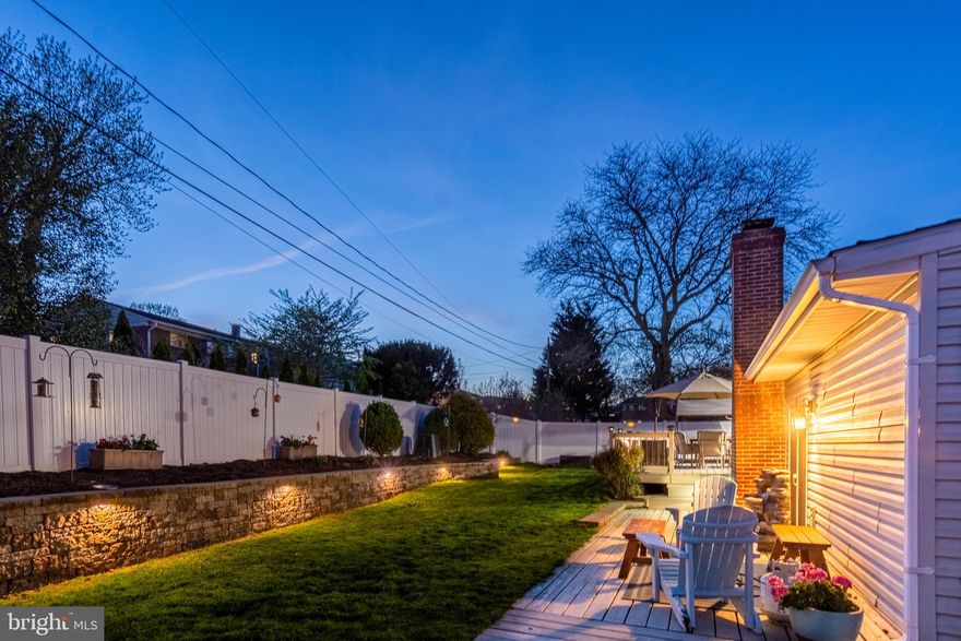 CONTEMPORARY ELEGANCE RADIATES THROUGHOUT THIS 2,400+ SQ FT. HOME WITH AN INCREDIBLE BACKYARD OASIS!  The main level features hardwood floors throughout, an inviting living room, separate dining area, gourmet Chef's kitchen with granite counters, ss appliances, & tile backsplash, and a spacious family room with vaulted ceilings.  The upper level offers 3 generously sized bedrooms with 1 full bath.  The finished lower level has a charming family room with wood fireplace, 4th bedroom, and 2nd full bath.  The impressive backyard is the perfect place to entertain with a deck, yard, and attractive vinyl fencing and retaining wall with exterior lighting.  Storage is not a problem - the one car garage offers the perfect storage space and the driveway makes parking a breeze.  Perfectly located minutes from 695 & 83 and convenient to tons of shopping and restaurants.  Pack your bags and move right in!