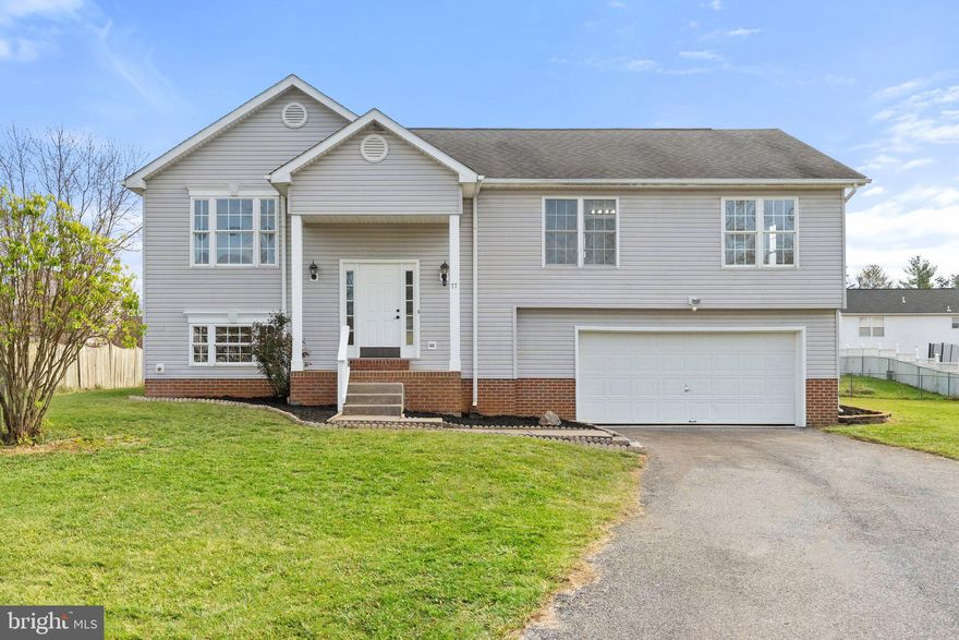 Perfectly updated 5-bed, 2-bath split foyer on an expansive lot! Recent upgrades include a brand-new HVAC system, fresh interior paint and more. The stylish eat-in kitchen features quartz counters with deep inset sink, stainless steel appliances, and ceramic tile flooring. Adjacent is the dining area leading to a 12x14 deck with stairs overlooking the generous backyard. The primary bedroom offers a walk-in closet and an en suite bathroom. Additional highlights include an oversized garage with ample storage space and access to the community tot lot. Conveniently located near commuter Routes 9 & 340, the Hollywood Casino, dining, shopping, and the historic towns of Harpers Ferry and Charles Town. Move-in ready for a lifestyle of comfort and style!