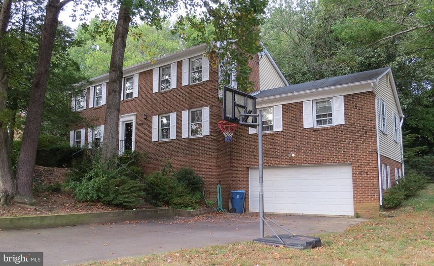 Large, beautifully maintained colonial in a friendly, quiet cul-de-sac. Hardwood floors throughout. Five large bedrooms on upper level including Master with large closets and ensuite bath. Huge 600 sq.ft. recreation room. Full basement allows for limitless storage and provides a second refrigerator. Nice large yard. Express bus to Pentagon/Metro one block away. Easy access to Beltway and HOV Lanes. Wakefield Forest/Frost/Woodson school district. Easy access to Cross County Trail. Five minute walk to playground, park and pool. Swim and tennis club membership available.