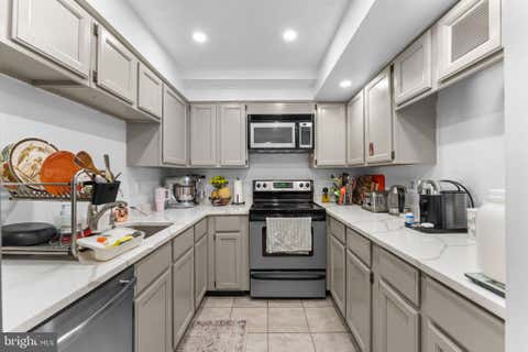 Photo of 7720 Tremayne Place #111, MCLEAN, VA 22102 (MLS # VAFX2308128)