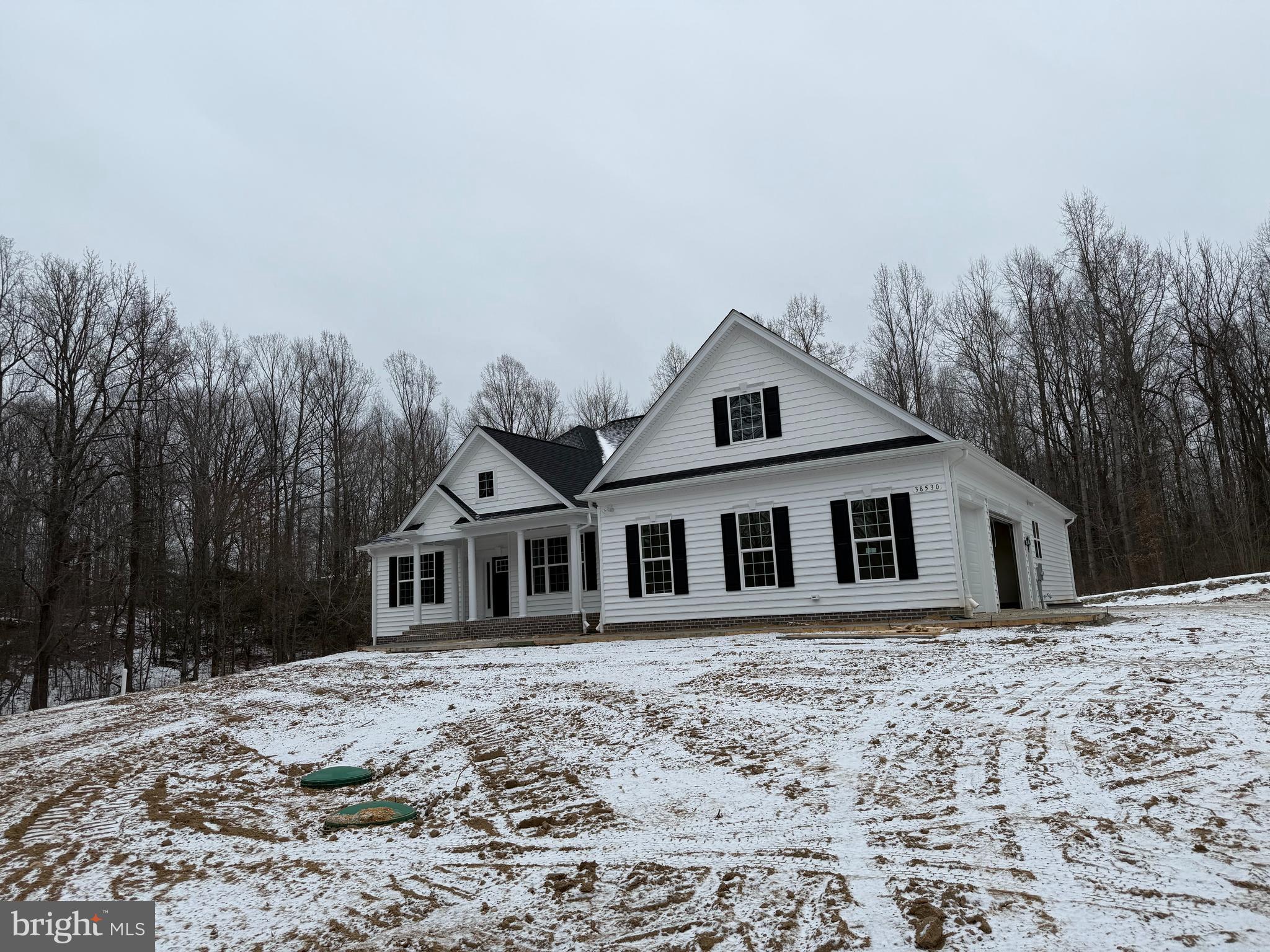 Stunning QBHI Ashland on this gorgeous 20 acre lot in Charlotte Hall, MD. Featuring 3 car sideload garage, a couple extensions throughout this home to add extra square footage and size to the rooms. Owners suite has a large full bath with separate vanities, tub and shower, and a huge walk in closet! Mudroom with an added powder room. Upgraded kitchen with table space area, family room, dining room, laundry room, plus screened in porch. Basement is unfinished for future plans.