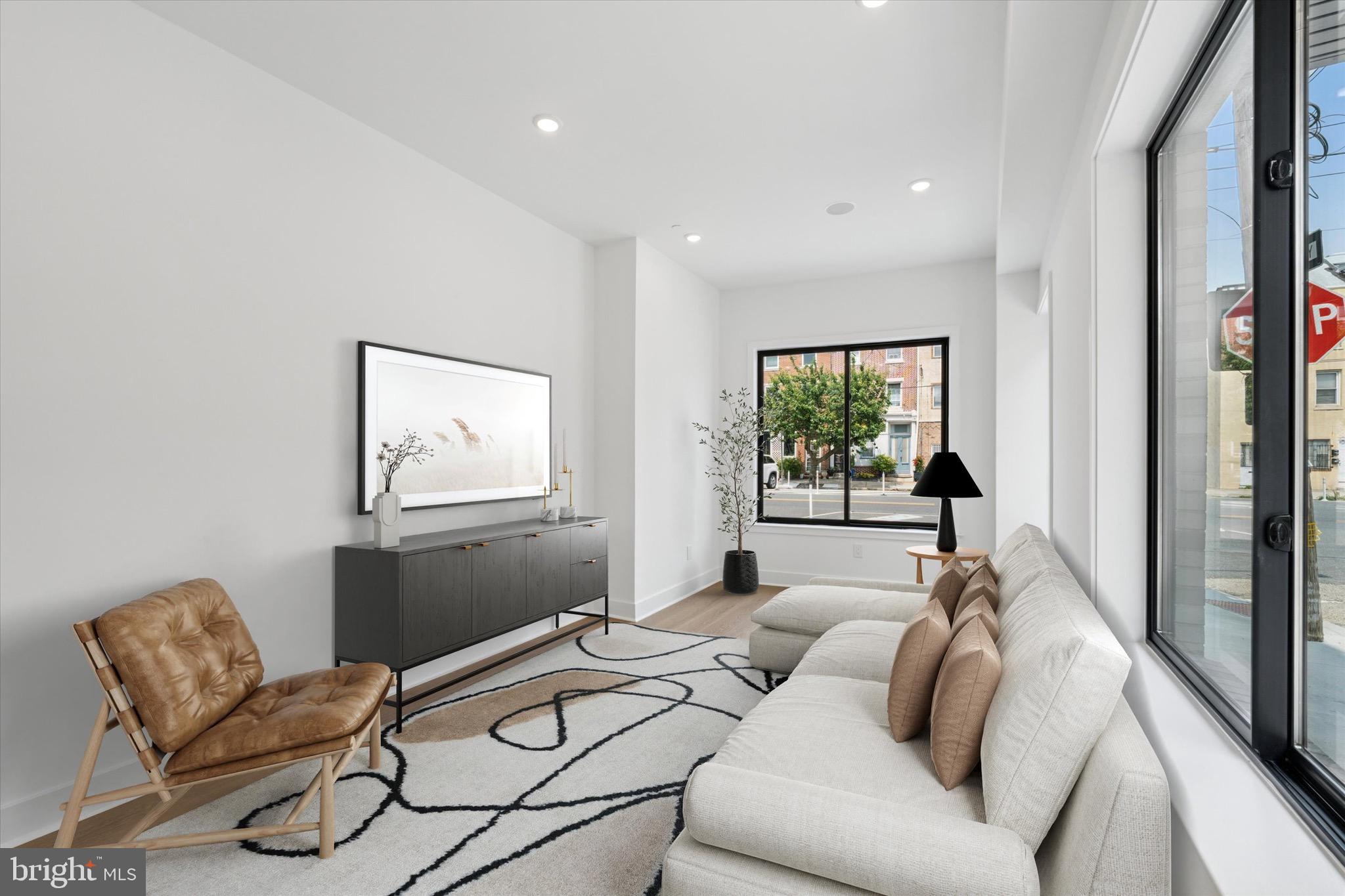 Welcome to this stunning brand-new construction corner property in the desirable Bellavista neighborhood of Philadelphia. Beautifully designed and offering modern luxury and spacious living. This bottom unit is 3 bedrooms and 3.5 bathrooms. Upon entering the home the abundance of natural light throughout is undeniable. Bright and airy atmosphere, perfect for everyday living. Soon as you walk in, the glass railing and the large ultra modern kitchen catches the eye. The private yard off the kitchen can be used however you like as. The half bath on the first floor makes it even more convenient. 2 beds and 2 baths upstairs with spa like bathrooms and 1 bed and 1 bath in basement with SECOND living room. The spacious layout is ideal for entertaining, with high-end finishes and plenty of room to relax. Custom closets in each bedroom, top-tier finishes, combining style and functionality...this home truly has it all. The condo fee includes water and insurance