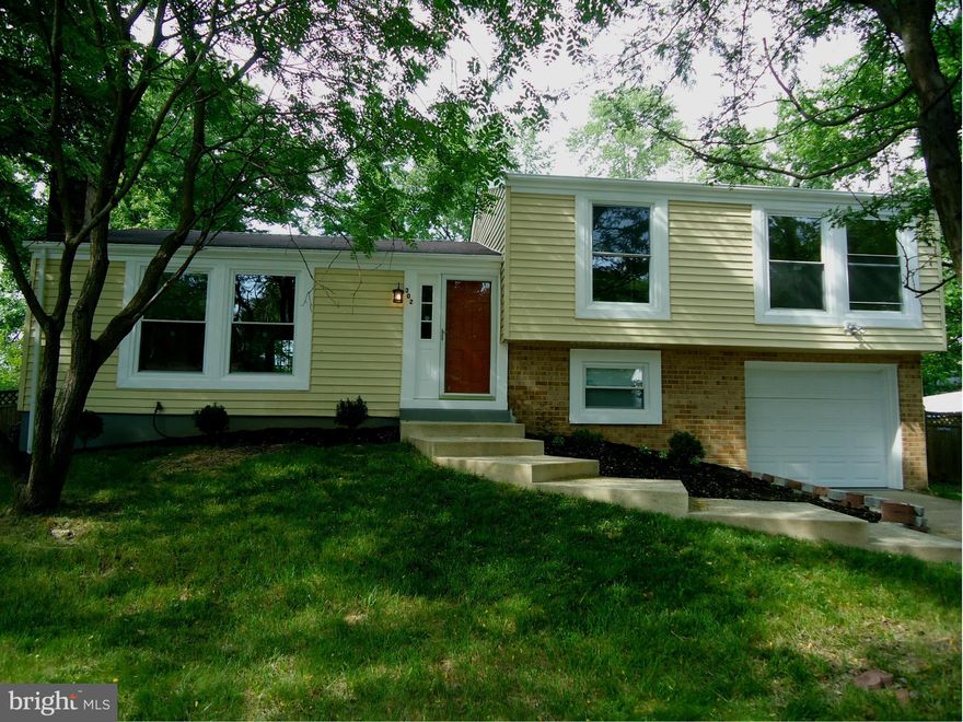 Gorgeous 4 Level Single Family Home! Renovated and move in ready..features cherry hardwood flooring in main level, spacious kitchen, brand new cabinets, granite countertops, backsplash  & SS appliances.  Remodeled baths with skylight windows! Brand new HVAC and water heater! Two rec rooms for entertainment and a fully fenced backyard.  Convenient location!