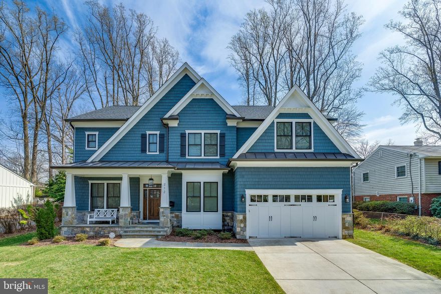 Stunning modern craftsman home! Located in the Town of Vienna’s sought-after Madison school pyramid.  This home surpasses 5,800 SF of living space spanning 4 levels, 6 bedrooms, and 6.5 baths.  The home’s exterior features a welcoming front porch and an expansive backyard with a custom deck.  As you enter the home the extensive trim details, hardwood floors, and 10’ ceiling height will impress you.  The main level includes a living room / study, dining room with connecting butler pantry housing custom cabinetry, sink and beverage / wine refrigerator.  The family room offers large windows that permeate an abundance of natural light into the space.  The family room also features lit coffered ceiling and an impressive stone gas fireplace.  The gourmet kitchen is a masterpiece, displaying bright white cabinets, wood beams, and a large island with ample seating.  The kitchen appliances consist of a Thermador 48” range with a pot filler conveniently located, Thermador 64’ built-in fridge / freezer columns, wall oven / microwave combination, and two dishwashers. The kitchen houses a combined coffee and desk area, and large pantry.  The nearby mudroom has a built-in dog station.  The second level comprise of three large-sized bedrooms with walk-in closets and bathrooms.  The main bedroom suite includes a sitting room and his and hers closets with custom shelving.  The owner’s bathroom features multiple vanities, heated tiled floors, a large soaking tub, and a shower surround with double wall showerheads and a rain head.  The third level / loft has a large open area supplying lots of natural light from the two skylights and nearby bedroom and bathroom.  The lower level provides a recreational room with an additional stone gas fireplace, game area, wet bar, theatre room, and a multi-purpose use space that can be an office, exercise room, or storage area.  The lower level has an additional bedroom and bathroom. Make this fantastic property your home!