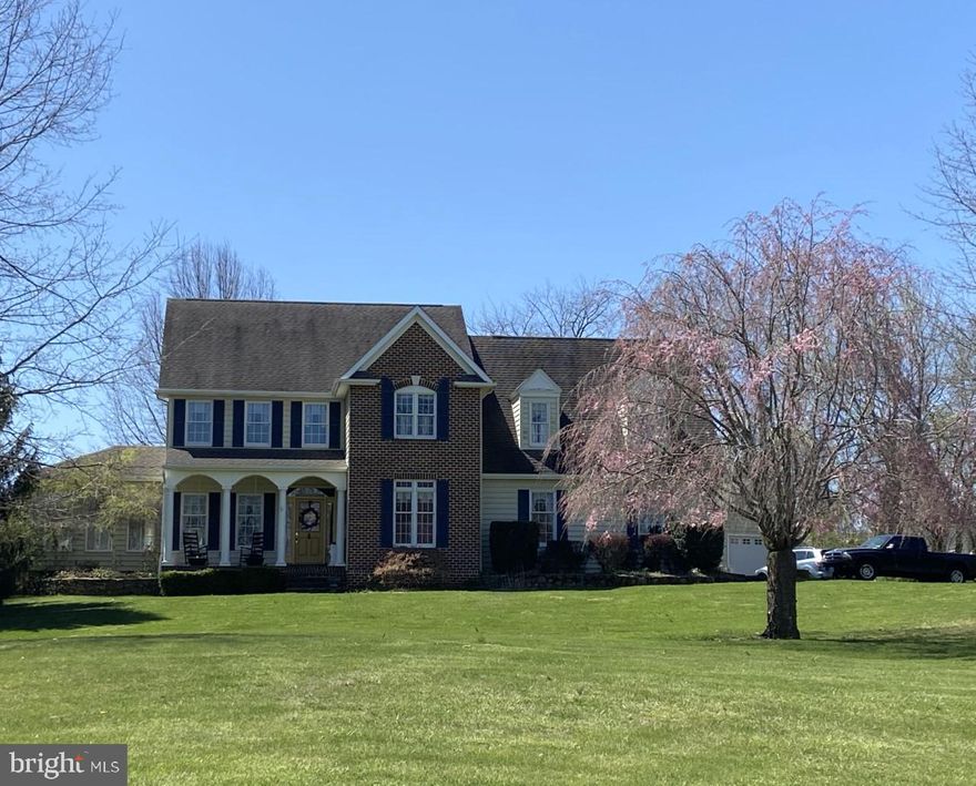 The attention to detail in this partial brick, 4 bedroom, 2 full & 2 half bath home is amazing. Wide-plank pine flooring,  crown molding and other wood trim details, and custom shutters and blinds can be found through out for starters. The remodeled, custom gourmet kitchen features a gas range, separate wall oven, lighted cabinets, pull-out shelves, an apron sink , sparkling granite counters and a tin ceiling.  The sunroom boasts a sealed brick floor and exterior exit.  The family room with gas fireplace leads out to the massive, multi-level deck with retractable awning. The stamped concrete patio leads to the gazebo and beyond. Upstairs are four large bedrooms all with walk-in closets. The primary bedroom features two walk-in closets and luxury bathroom with jacuzzi tub, granite counters and two vessel sinks. The partially finished basement offers a large family room and a half bath. On this level you will also find plenty of storgae space and a walk-up exit to the side yard. All this plus a generous-sized laundry/mud room, an attached, oversized two-car garage with work bench, and a detached oversized one-car garage. The home and 3 plus acre grounds have been meticulously maintained.
