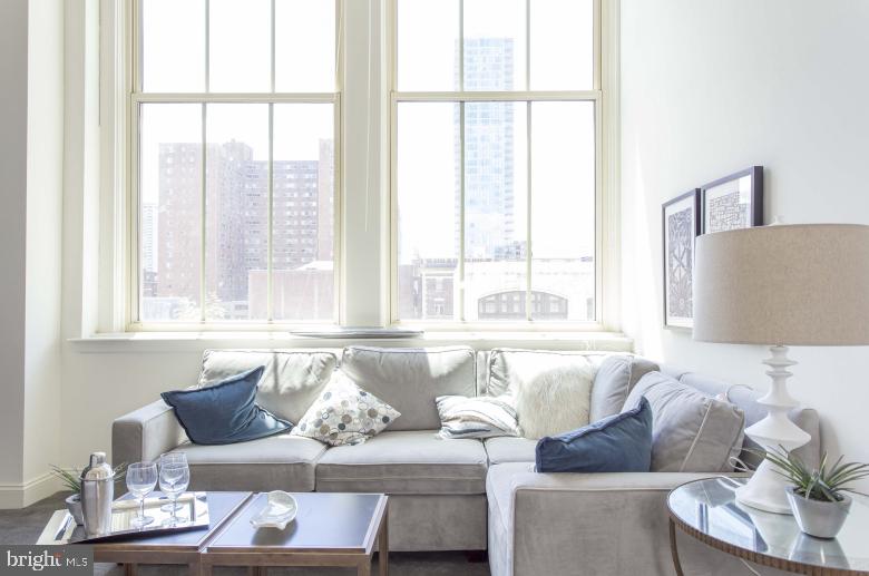 Enjoy living in this former tuxedo warehouse which has been transformed into fabulous loft style apartments! 2121 Market Street Apartments offers stunning city views! Located in the Rittenhouse Square neighborhood, the spacious apartments feature super high ceilings with expansive 14-foot windows, open floor-plans and amazing natural light. The kitchens are fully equipped and include a breakfast bar. Amenities include a resident sky box with a state of the art fitness center and resident lounge, roof deck with breathtaking city views, 24/7 front desk attendant. We love pets! The building is super pet friendly and welcomes dogs and cats. Trader Joe's is conveniently located on the lower level. Enjoy everything that the city has to offer at 2121 Market Street. **Photos pictured are of the model unit with a similar floor-plan.