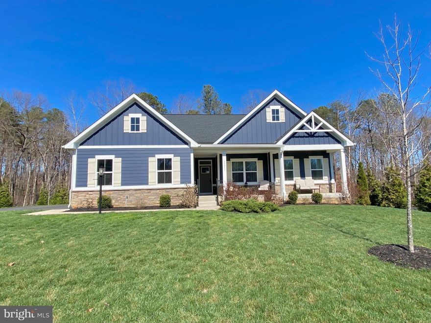 Anchored in the ​luxurious gated lake and golf community of Fawn Lake​ in Fredericksburg, Virginia, this Gorgeous nearly new Dream Home offers ​a modern​, warm and inviting atmosphere ​throughout.
​
Beautifully designed, this ​Modern Rancher built in 2022, boasts ​main level living on a​ flowing open floor plan ideal for​ casual, everyday living​, and entertaining​. 

​At the center of the home is a spacious ​Family ​Room ​that flows seamlessly to an impressive ​Gourmet ​Kitchen featuring a massive island, quartz countertops, double ovens, ​tile backsplash, and a large pantry, perfectly suited for both everyday living and entertaining. The ​adjoining Sunroom flooded with brilliant sunlight, serves as an ideal Dining​ Room. Sliding doors provide easy access to a​n inviting covered porch, perfect for indoor-outdoor gatherings. 
​A quiet retreat, the main level Owner’s Suite with ​private access ​outdoors to the serene covered ​porch, features a beautiful light-filled Spa Bath with dual vanities and tile shower.​ ​Double walk-in closets​ offer plenty of wardrobe ​storage. 

Two additional gracious Bedrooms with walk-in closets share a beautiful Full Bath.
The convenient main-level Laundry Room provides everyday ease.

​Expanding the living space, the amazing walk-out lower level features a massive Recreation Room, which provides unlimited entertainment possibilities. A huge Bedroom with an adjoining Full Bath ​offers comfortable ​extended living for Guests. ​ Glass sliding doors provide direct access to an inviting ​Flagstone patio overlooking the private backyard abutting to a wooded conservation area​.
​ 
​The serene natural backdrop makes outdoor living​ just as special​. Exceptional privacy, peaceful moments and effortless entertaining on the covered rear porch ​can be enjoyed year-round. 
​This turn-key Home is nestled on .40 acres at the end of a quiet​ cul-de-sac, ​near the Fawn Lake Marina​! Take daily strolls or bike rides along the nearby trails ​to​ savor the beautiful sights and sounds of nature​, or meet friends​ at the marina. Imagine​ kayaking, ​paddleboarding, fishing, swimming and breathtaking sunsets​ only steps from your front door! 

Enjoy the exceptional ​Fawn Lake lifestyle and live with ease in this nearly new turn-key home, expertly crafted with energy efficient materials such as a high efficiency HVAC, low maintenance ​Hardi-Plank siding and stone exterior finishes.​  Here you can downsize your home, while elevating your lifestyle!​ Come experience the Fawn Lake Lifestyle and start enjoying our unique way of life!
​
The beautiful luxury and vibrant Fawn Lake Community offers amazing amenities such as a boating recreational lake, sandy beach, an Arnold Palmer designed Golf Course, tennis courts, baseball and soccer fields, dog park, volleyball courts, walking trails, Community ClubHouse, marina, fitness center, restaurants, Country Club, playgrounds, and so much more! Plus with an array of clubs, groups and daily activities, you will have plenty of opportunities to join the social scene, make new friends and remain active all year-round!
Located in the countryside near the town of Fredericksburg, surrounded by park lands and only a few miles to the farm market, wineries, and award winning breweries! Conveniently located to shopping, restaurants, top-rated Riverbend District schools and I-95!​  
Discover refined living in the prestigious lake and golf community of Fawn Lake.
