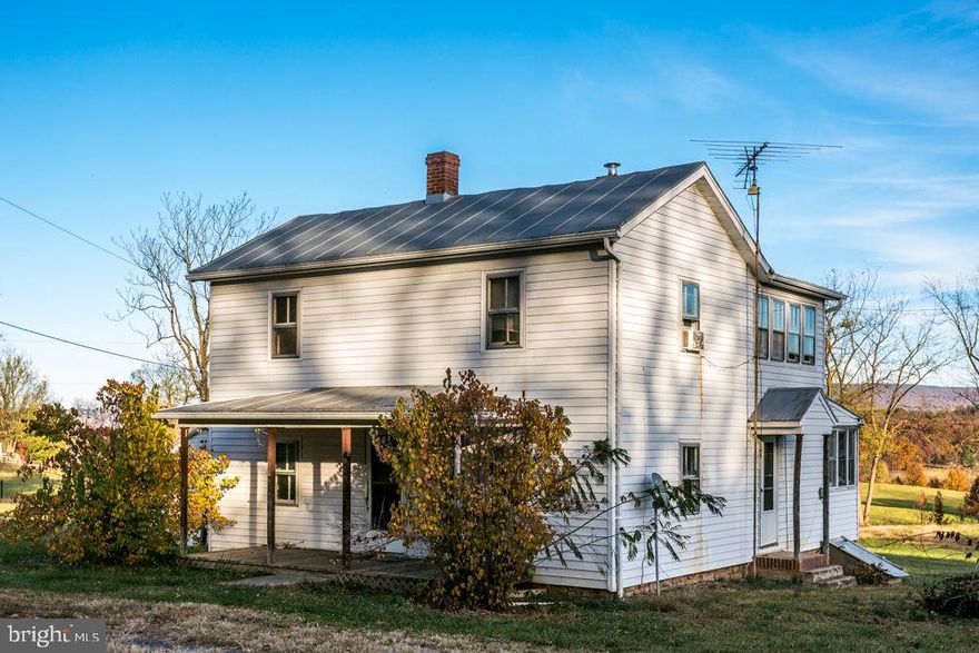 Rare opportunity to own this fixer upper just outside of the Broadway Town limits with views on gently rolling 1.091 acre tract divided from a larger tract. Eastern mountain views off the back porch! 2-story farmhouse with 4 bedrooms and 1.5 baths. Bedroom and 1/2 bath on the main level. Step into the foyer from the covered front porch that takes you to the upper level with 3 bedrooms, office/den and full bath. Country kitchen withbreakfast nook featuring knotty-pine walls. Enclosed porch for possible laundry area. There is a back staircase to the upper level from the kitchen that can be closed in and space used to expand kitchen. Detached concrete block single garage/workshop. Sold As Is.