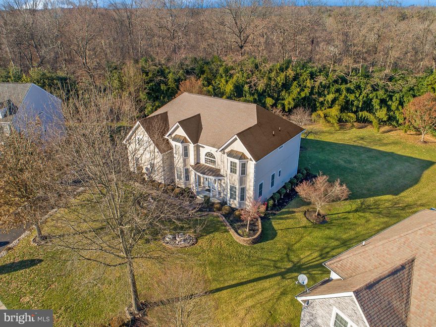 This Deerbrook Colonial is second to none.  This 5/6Bedroom 4 1/2 Bath beauty has over 4000 square feet of living space upstairs and additional 1600 square feet in the finished basement.  The homeowners spared no expense and have meticulously decorated and upgraded the property over the years. Enter the two-story foyer and you will be drawn to the staircase and opulent chandelier to your right is the living room featuring the decorative crown molding and the understated ceiling fretwork on the opposite side of the foyer you will find the dining room with the same distinct decor. As you walk toward the back of the first floor your eye will be drawn to the magnificent hardwood floors and the two-story family room featuring a gas fireplace vaulted ceiling and tasteful custom drapes.  Just off the family room is the large eat-in kitchen featuring upgraded cabinets, a commercial hood vent, and beautiful granite, if all of this isn't enough the kitchen also includes a built-in desk with cabinetry and a wine fridge not to mention there is a large sitting room off the kitchen to enjoy your morning coffee.  The first floor also includes a large laundry room a nicely appointed office which can be used as the 6th bedroom and a large two-plus car attached garage.  If the downstairs isn't enough the upstairs of the home is just as breathtaking featuring 4 full bedrooms and 3 Baths.  The Master Suite is equipped with a large sitting room including another gas fireplace, two walk-in closets, a custom tray ceiling, and decorative crown molding. The open hallway upstairs allows stunning views of both the foyer and family room.  The three bedrooms upstairs all feature crown molding and one includes another bath perfect for the family member who enjoys their privacy.  In addition to all the features mentioned the entire second floor has been freshly painted and includes new hardwood flooring that accentuates the space perfectly.  If you need more space there is also a finished basement with a full bathroom and bedroom a large living area and a very generous game room or rec room for the kids. The basement has fresh paint and new vinyl floors as well. The HVAC system was replaced in 2019 and the stucco was redone in 2017. There is a working central vacuum system and built-in speakers as well. This truly is the home you have been waiting for so make an appointment before it is to late.