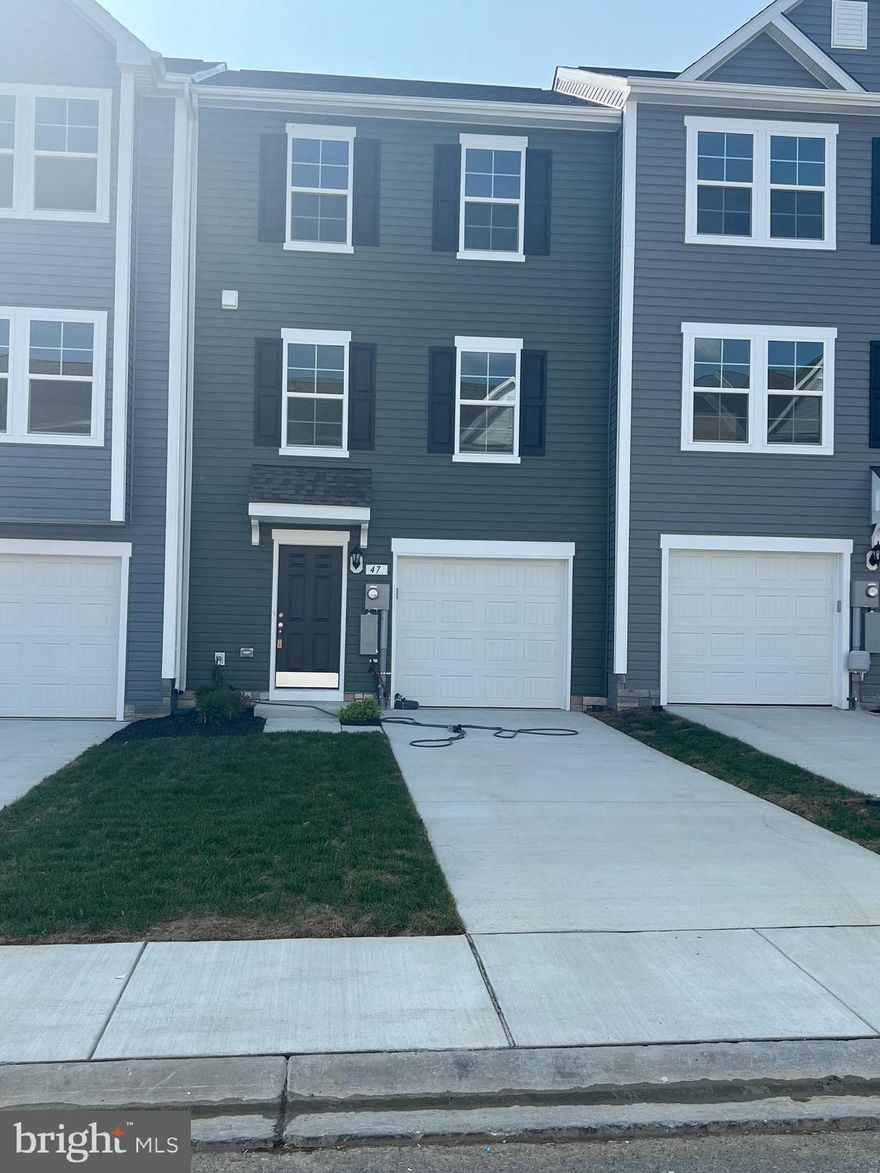 DRB Homes Overlook at Riverside - For GPS: The Property is in Next to this address: 42 Belmont Pl FALLING Waters, WV 25419...Next to Children / Dog Park - Brand New Town Home 4 Bed Rooms, 3.5 Bath, Upon entry of this wonderful townhome, a finished rec room (can use as a 4th Bed Room) with a full bathroom. The main level offers luxury vinyl plank flooring throughout and a spacious living room with a powder room. The eat-in kitchen features an island, Quartz countertops and stainless steel appliances. The spacious primary suite features a generous walk-in closet and an en suite bath with a dual sink vanity and an oversized seated shower. Two secondary bedrooms & full bath, a linen closet and a centrally located laundry complete the upper level! Set in a wonderful new community, Dog Park, Children's park, Basket Ball Court, Tennis Court, and Recreation sit up area are free amenities. In a prime location for I-81, Rt 11, I-70 commuters, mountain views, walking distance to shopping, and restaurants, access to Spring Mills schools, and close to interstate just minutes from the MD line. This rental may not last long.