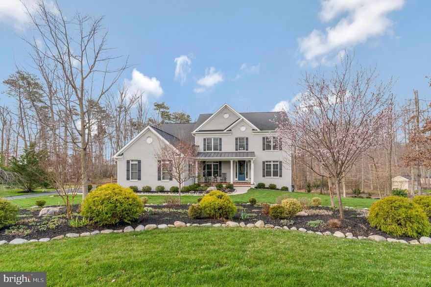 Semi-custom built in 2016, this elegant home is only seven years young! Nestled in a quiet, wooded cul-de-sac in desirable Occoquan Overlook, this home truly stands out with many upgrades, finishes, and features that other homes in the community simply don't have. It is not your usual cookie cutter home! The super large kitchen is a gourmet’s dream with Thermidor appliances, a huge walk-in pantry, leathered granite countertops, farm sink, tons of soft-close cabinets and drawers for storage with an extended kitchen island that has additional seating and extra storage! A six burner range with a hooded, gas cooktop and double wall ovens! Large trex deck off the breakfast room area. The breakfast room opens to an expansive family room with a gas fireplace and a 20' vaulted ceiling that soars with lots of windows, letting in tons of light. From there, enter the expansive (20 x 18') four season room (built in 2018) with its herringbone pattern brick floor, rows of windows, wood burning fireplace, and separate hvac for year-round comfort. The first floor also features a formal office/study, a half bath, Living Room and elegant, separate, formal dining room with a beamed ceiling. Upstairs, welcome to the large owner's suite with a huge walk-in finished closet, sitting area, and en-suite with its beautiful, massive shower. You will also find two other carpeted bedrooms, a full bath, laundry room, and a study/sitting area where you can cozy up to a book. Beautiful sand-in place hardwood floors throughout the upstairs and downstairs levels. Solid core and glass panel doors add a touch of elegance. This home also has a fully finished walk-out basement (built in 2023) with porcelain tile that resembles hardwood. Here you will find a large living/gaming space with another fireplace, a large bedroom, full bath and linen closet, study, wet bar, and large storage/utility area. Outside you will find an oversized flower bed with year-round interest and formal landscaping with a sprinkler system. Three car attached garage. Near 95, good schools, and easy commuting. Don't miss out on your opportunity to own this home! Make an appointment for viewing today!