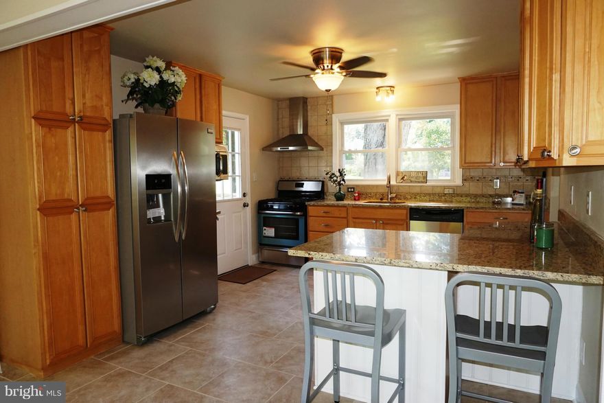 **REDUCED**MUCH LARGER THAN APPEARS & TOTALLY RENOVATED**FEATURING NEW CARPET, PAINT, GRANITE, LIGHT & PLUMBING FIXTURES, CERAMIC TILE, SS APPLIANCES, INSULATION, BREAKFAST BAR, HARDWOOD FLOORING, ROOF & 2 DECKS*LARGE FINISHED LL W/ FULL BATH & WALK OUT OFFERS MULTIPLE OPTIONS*HUGE FENCED YARD FOR MANY OUTDOOR ACTIVITIES***AWARD WINNING BROADNECK SCHOOLS***CLOSE TO ROUTES 50 & 2. HOME WARRANTY.