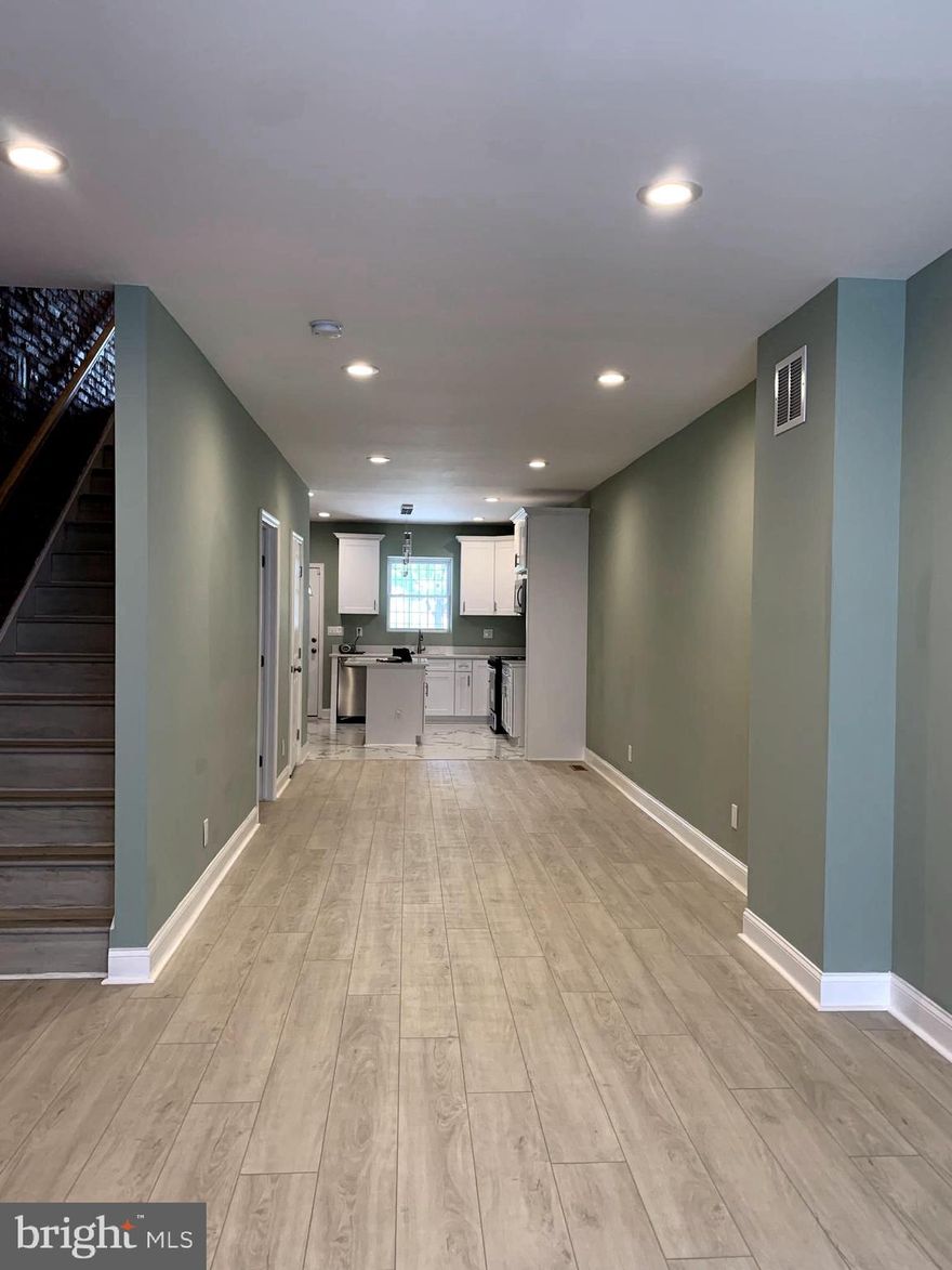 AMAZING BEAUTIFULLY RENOVATED 3 BR/ 3.5 BATH HOME EXQUISITELY DESIGNED AND CRAFTED. CONTEMPORARY LIVING, ELEGANT EAT-IN GOURMET KITCHEN FEATURES CUSTOM 42" CABINETRY WITH UPGRADED TRIMS, GRANITE COUNTERTOPS, ISLAND, SS APPLIANCES, 9FT CEILINGS, LED LIGHTING, BEHIND THE KITCHEN IS A HALF BATH, WALK OUT KITCHN DOOR LEADING TO THE LARGE FENSED BACK YARD. EXPOSED BRICK MAINTAIN THE HISTORIC CHARACTERISTICS OF THE HOME. SECOND FLOOR HAS 2BR 2 BATH. MASTER SUITE WITH A LARGE FULL BATH WITH SEPARATE VANITIES. SECOND BR HAS  ACCESS TO THE LARGE BALCONY,  A FULL BATH. LOWER LEVEL LEADS TO THE LARGE CLEAN FULLY FINISHED BASEMENT ALONG WITH A LIVING SPACE, THIRD BEDROOM OR GUEST SUITE WITH A FULL BATH, SEPARATE LAUNDRY AREA, UTILITY AND STORAGE ROOMS. TO TOP IT OF THIS HOME ALSO HAS NEW PLUMBING, ELECTRICAL, HVAC SYSTEM AND A BRAND NEW ROOF. HOME TECH INCLUDING PROGRAMMABLE DIGITAL THERMOSTAT AND FIRE CARBON MONOXIDE DETECTORS, ENTIRE HOME FRESHLY PAINTED.