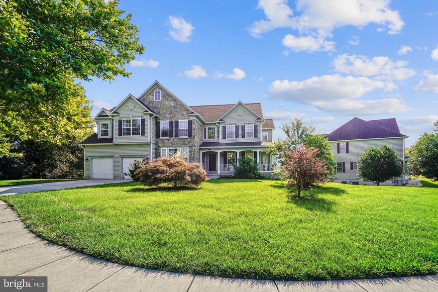 Stately Colonial - Situated on Over a Third Acre Lot in Sought-after Fairwood.  The Welcoming Covered Front Wrap-around Porch and Stone Front Grace this Home as you Enter to the Dramatic Two-Story Foyer with Hardwood Flooring. Over 6,000 sq. feet of Living Space in this Beauty.  Formal Living and Dining Rooms with Crown Molding and Custom Lighting.  Main Level Office, Full Bath, and Laundry. Impressive Two-story Family Room with Floor-to-Ceiling Stone Fireplace and Secondary Staircase.  The Gourmet Kitchen Features an Expanded Island with Leather-Granite Counter, Tons of Cabinets and Granite Counters, and Table Space. The Upper Level has Impressive Primary Bedroom with Renovated Primary Bath, Sitting Room with Gas Fireplace and Plenty of Closet Space.  Two Additional Bedrooms and Hall Bath, Plus 4th Bedroom with en-Suite Bath.  The Lower Level Features a Walk-Out Finished Basement with Massive Entertaining Space, Exercise Room, Full Bath and Two Bonus Rooms, (possible 5th and 6th Bedrooms). Updates include New Roof and Gutters (2019), HVAC (2020), Water Heater (2022). Fairwood is an Amenity Rich Community Within Close Proximity to World Class Shopping, Dining, and Commuter Routes.  Sold as-is.  Seller is offering a one year HSA home warranty.  Motivated Seller!  Now is a GREAT time to BUY!