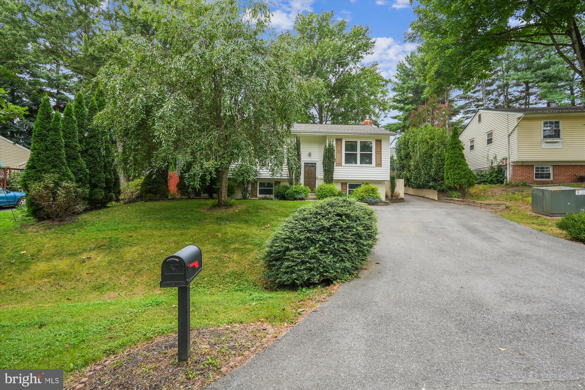 Welcome to this beautifully expanded and updated home in The Plantations! This spacious 4-bedroom, 3-bathroom residence sits on just over a quarter-acre lot and offers a blend of comfort, style, and functionality. Step inside to find gleaming hardwood floors throughout the main level, leading to an expansive family/great room featuring skylights, custom built-ins, and a cozy wood-burning fireplace . The generously expanded primary suite is truly a retreat, featuring an en-suite bath with walk in shower, double vanity and ample space for relaxation, reading, and recharging. The kitchen is on full display with Zodiac counter tops, induction stove, stainless appliances and beautiful cabinetry. The finished lower level features a fourth bedroom, full bathroom and a large recreation space which can accommodate guests, a home office, or multi generational living. The backyard is a show stopper and provides multiple outdoor experiences with a firepit, patios, a playset, and plenty of room to entertain or unwind. This home is a rare find—offering space, upgrades, and standout features both inside and out. Additional updates include (roof 2020, dishwasher 2025, microwave 2024, HVAC 2018, washer/dryer 2018) Welcome Home!