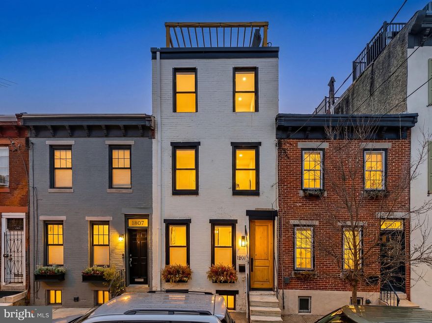 1805 Webster Street offers a rare combination of contemporary luxury and neighborhood charm in the heart of Graduate Hospital. This meticulously renovated home spans three levels of thoughtfully designed living space, featuring three spacious bedrooms, 2.5 designer baths, a fully finished basement and incredible outdoor spaces. The open-concept main floor immediately impresses with its custom wood entry door, warm exposed brick, and a gourmet kitchen equipped with crisp white cabinetry, quartz countertops, and an expansive island perfect for entertaining. The luxury continues in the primary suite, which boasts a generous walk-in closet, now upgraded with custom California Closets and a spa-like en suite bathroom. Two additional sun-filled bedrooms also feature premium California Closet systems, ensuring maximum organization and style.  Outdoor living is a standout feature of this property, with three distinct spaces culminating in a spectacular roof deck that offers panoramic views of the city skyline. For added convenience, the laundry center is located on the second floor, saving you trips to the lower level. Beyond the home’s walls, you are perfectly positioned to enjoy the best of Philadelphia; take a scenic stroll straight up 18th Street to the world-class shopping and dining of Rittenhouse Square, or explore local favorites like Heirloom Market, Sidecar Bar & Grille, and the Julian Abele Park. With a highly coveted partial tax abatement (estimated to have approximately 5 years remaining), this home is as smart an investment as it is a beautiful place to live. Schedule your showings today.