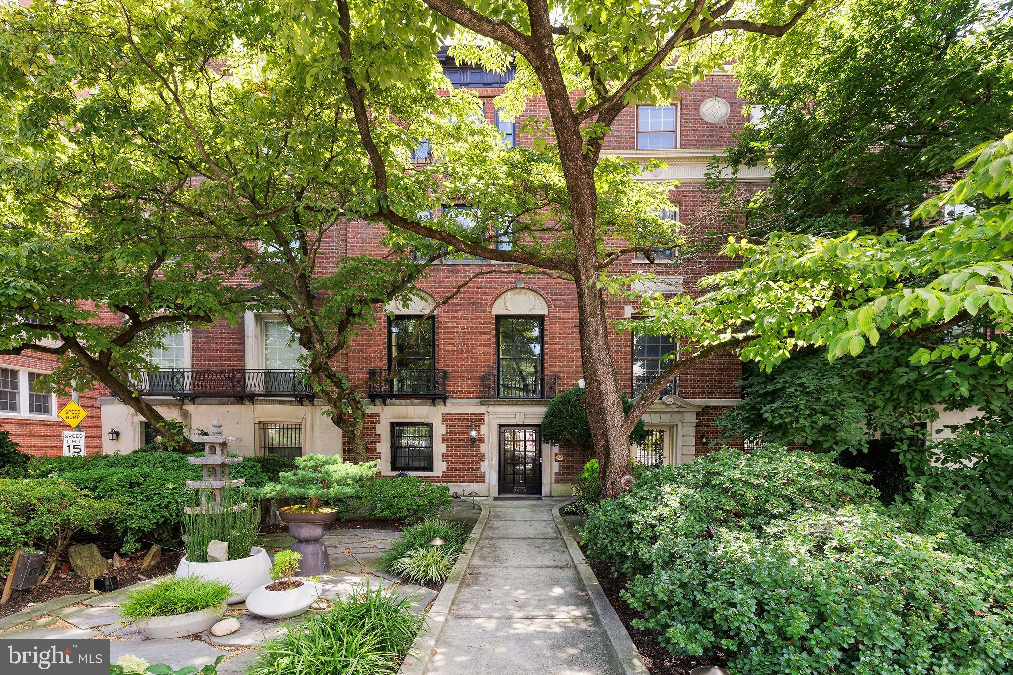 Quintessential Embassy Row brick and limestone house designed by architect JH de Sibour, who also designed the clubhouse at the Chevy Chase Club. Arguably the most beautiful neighborhood in Washington, this house had a detailed restoration that preserved original mouldings, medallions, mantels and provided 5.5 new baths, a true chef's kitchen, new large terraces off 2nd and top floors, 3 re-lined chimneys. Garage + 3 parking spaces, 5+ bedrooms, owned solar panels and intricate period details throughout. Accessible entry floor (no steps in front) has foyer, front stairs w/hand-made Persian stair runner, office/bedroom, accessible bath, storage, garage, rear stairs, office & powder room. Next level has grand piano-size reception room that opens to large living room in front w/oversized windows overlooking the front garden and large, formal dining room to rear that opens to large, private deck and newer kitchen just beyond. Next floor has a large front bedroom w/en-suite bath, laundry room, library w/fireplace, rear bedroom and additional bath. Top floor has large front bedroom w/expanded marble en-suite bath, copious closets and two additional bedrooms and another full bath and large deck with views toward Rock Creek Park. Hiking trails just over the bridge and Dupont Circle in the other direction. Newer air conditioning and plumbing.