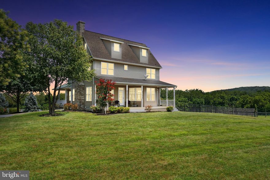 Experience country living at its finest in this custom-built home set on 34.49 scenic acres of open pasture and paddocks, with breathtaking views from every window. This thoughtfully designed 4-bedroom, 4-bathroom home showcases exceptional craftsmanship across four finished levels. The main level features beautiful hardwood flooring, a bedroom with a full bathroom—ideal for guests or multi-generational living—and a spacious living room with a cozy fireplace. The gourmet kitchen is a chef’s dream with a large center island, granite countertops, stainless steel appliances, gas cooktop, wall ovens, and a bright breakfast nook. A separate formal dining room offers the perfect setting for entertaining. Upstairs, the expansive primary suite boasts vaulted ceilings, luxury vinyl plank flooring, dual walk-in closets, a spa-like ensuite bath, and a private balcony with sweeping views of the Blue Ridge Mountains and Sugarloaf Mountain. Two additional bedrooms share a Jack-and-Jill bath, and a full laundry room adds convenience to the second level. Need more space? The finished fourth-level bonus room is ideal as a playroom, office, or guest retreat. The lower level offers a large family room, full bathroom, second laundry area, and ample storage throughout the home. Enjoy peace of mind with a brand-new dual-zoned geothermal heating and cooling system. The outdoor living space is just as impressive, offering an expansive backyard perfect for gatherings with friends and family. Equestrians and hobbyists alike will appreciate the 60'x36' Conestoga Pole Barn, designed with both functionality and comfort in mind. The barn features 6 convertible stalls—allowing for traditional stabling or free-choice access—a center aisle, Dutch doors, a heated tack and utility room, feed room, kitchenette, wash stall with heat, and an attached hay storage shed. Each stall is equipped with temperature controlled fans, and additional ventilation is provided in the aisle and overhang. Nelson automatic waterers are installed in both the barn and every pasture. The 10.5 acres of pasture are fully fenced with mesh fencing, wood posts, and electric rope, and are set up for easy rotational grazing. Truly horse move-in ready and just 7 miles from Woodstock Equestrian Park! Whether you're seeking a private retreat, equestrian paradise, or room to grow, this extraordinary estate offers the perfect blend of luxury, functionality, and panoramic beauty. This residence is the closest home on the left once you turn into the driveway. DO NOT ENTER the property behind this home as that is private property that does not belong to this residence.