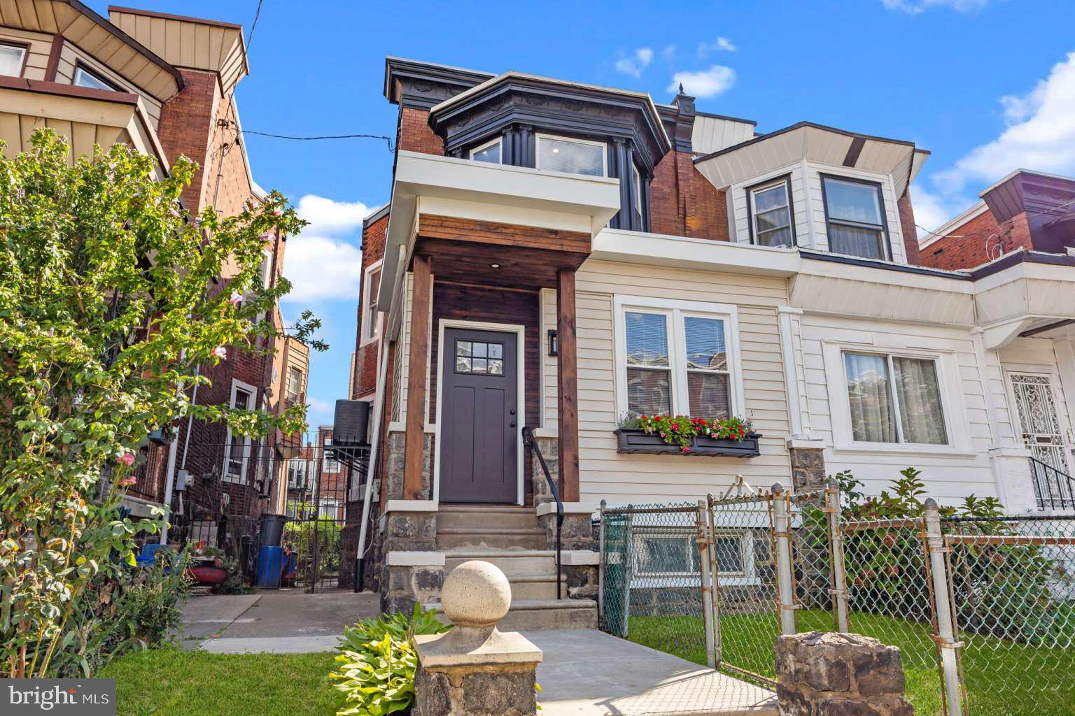 Welcome to this Stunningly Preserved West Philadelphia Home! Set on a tree lined street, this Beautiful Home has been completely restored saving the original detail! The character speaks volumes, while just the right touch of modern elegance has been fused. Walk into the Enclosed Front Porch with tremendous wood detail, exterior brick, modern wallpaper, and an impeccable Luxury Ivy Hill Vinyl Floor. Enter the vestibule with a Gorgeous High End Floral Tile, Original Woodwork, Stained Glass, Upgraded Pendant Lighting, and the Extravagant Wood Doors with a Traditional Gothic Victorian Stained Glass Entryway Door. The Living and Dining Rooms are Spacious with Lavishing original inlayed hardwood floors, Stunning Dining Room Doors with a similar Traditional Gothic Stained Glass, Original stained glass window, updated recessed lighting, craftmanship Staircase woodwork, and the Exquisite Wood Mantle with the Original tiles! The timeless kitchen has all brand new cabinetry with 42in wall cabinets, quartzite countertops, brand new Kitchen Aid stainless steel appliances, luxury pot holder, backsplash, farmhouse sink, chandelier space, wall mount tv outlet, and a modern chevron lifeproof vinyl floor. The original Built-In refrigerator has been converted into an astonishing coffee bar area! Main Floor Powder Room just off the kitchen! The laundry room/mudroom in the rear of the first floor has upgraded tile and a modern stainless laundry tub. There is a fenced rear yard just off the kitchen! Ascend the convenient second staircase to the upstairs which consists of Four spacious Bedrooms all with original Hardwood Flooring, and Two Full Bathrooms. The Primary Bedroom has an En Suite Bathroom, recessed lighting, two closets, modern ceiling fan, two way Pivot Shower door, and the gorgeous authentic brick fireplace with electric insert! The upstairs Bathrooms are both finished with Luxury High End Finishes. Beautiful original Built in Closets with Mirrors and detailed woodwork in the Rear Bedroom! The full basement is extremely large for an abundance of storage. The upgrades to this home are countless including New Roofs 2025, New Windows, Brand New Dual AC Systems with separate Zones, New Hot Water Heater, Brand New Exterior Siding, Kichler Light Fixtures, Ornate Radiators Throughout, Wall Mount TV Outlets, New Shaker Style Exterior Doors, Dusk to Dawn Motion Exterior Lighting, New Flood Lighting, Living Room/Bedroom Fans, Modern Vinyl Flooring, Large Baseboards, Delta & Moen Faucets, Dual Flush Toilets, and Recessed Lighting Throughout! Very close proximity to Upenn, HUP, CHOP, Drexel University, and Center City. This Home is a True One of A Kind Must See! Seller is licensed in PA. Virtual Staging Images