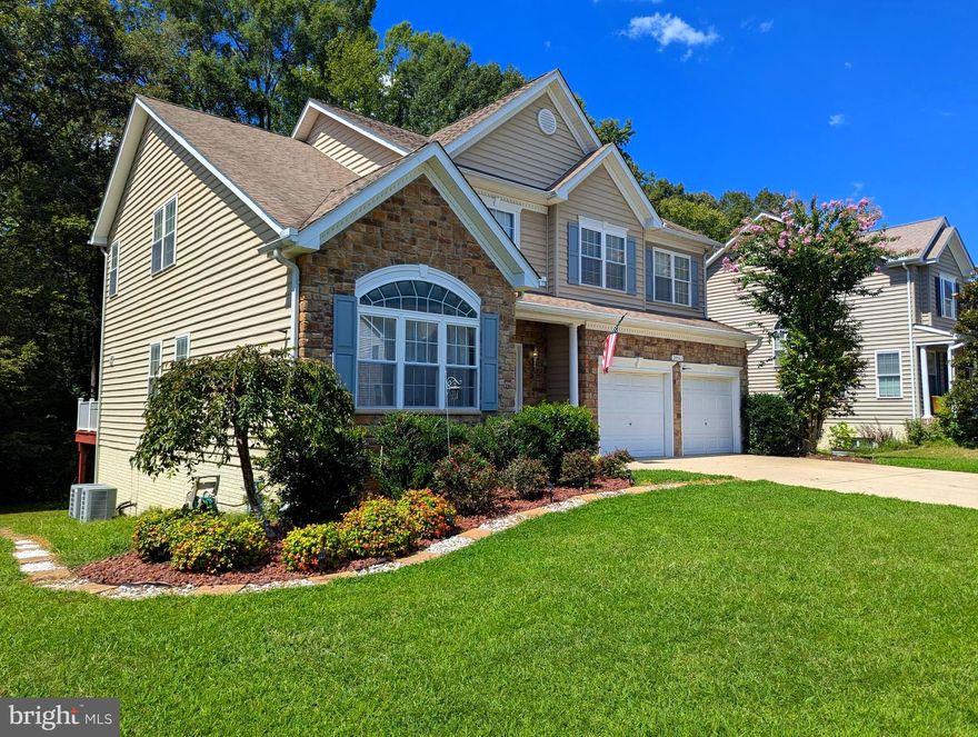 Great opportunity to own this charming, well maintained Colonial in the growing community of Pembrooke with over 4,100 square feet of overall living space across 3 finished levels! Appreciate the picturesque stone craftsmanship of the Quality Built Ashford model along with its pleasing landscape appeal. This 5-bedroom, 3.5-bath single-family home was thoughtful designed offering the perfect balance of comfort, function, and style. Step inside to be greeted by a bright, open-concept main level with two story foyer, gleaming hardwood floors and large windows that flood the home with natural light admiring the nine foot ceilings through much of the upper levels. The spacious living room with wood burning fireplace and coffered ceilings. The kitchen is a cook’s delight, with soft close drawers, stainless steel appliances. Upstairs, the spacious primary suite serves as a pleasant retreat, boasting a generous walk-in closet and a private ensuite bath with large grand shower and corner soaking tub. Three additional upstairs bedrooms including a full hallway bath all providing ample space for family, guests, or a home office. The basement level is a true guest / IN-LAW SUITE complete with kitchen, full bath, living and dining room area(s) a private office and additional storage as well an exterior entrance that could be ideal for a separate rental opportunity. The attached two car garage offers additional storage and convenient parking, even a possibility for a full-size truck. Step outback on the exterior deck area with a lush backyard or patio that backs to trees, ideal for summer barbecues, morning coffee, or playtime with pets. Top all that off with location perks that include enjoying proximity to NAS Patuxent River making this home an excellent option. You're minutes from local recreational spots like John G. Lancaster Park, scenic outdoor escapes like St. Mary’s River State Park and Elms Beach and many shopping centers, schools, and local restaurants galore. Commute-friendly, yet tucked away from the hustle, you’ll love the balance of peaceful suburban living with easy access to major routes. Whether you're a first-time homebuyer or looking for an investment in a growing community, that offers incredible value, modern comfort, and a welcoming neighborhood feel. Schedule your showing and submit your offers today! Seller will provide entry through showing co. no lock box