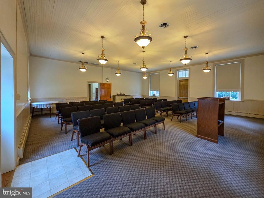 One-of-a-kind historic property offering endless potential. Previously used as a schoolhouse, duplex, and place of worship. Ideal for conversion to a residence, studio, coffee shop, daycare, offices, or multi-use space (subject to Township/County approvals). Situated on a large-acre lot with paved parking area and separate eat-in kitchen. Unique opportunity with flexible possibilities.