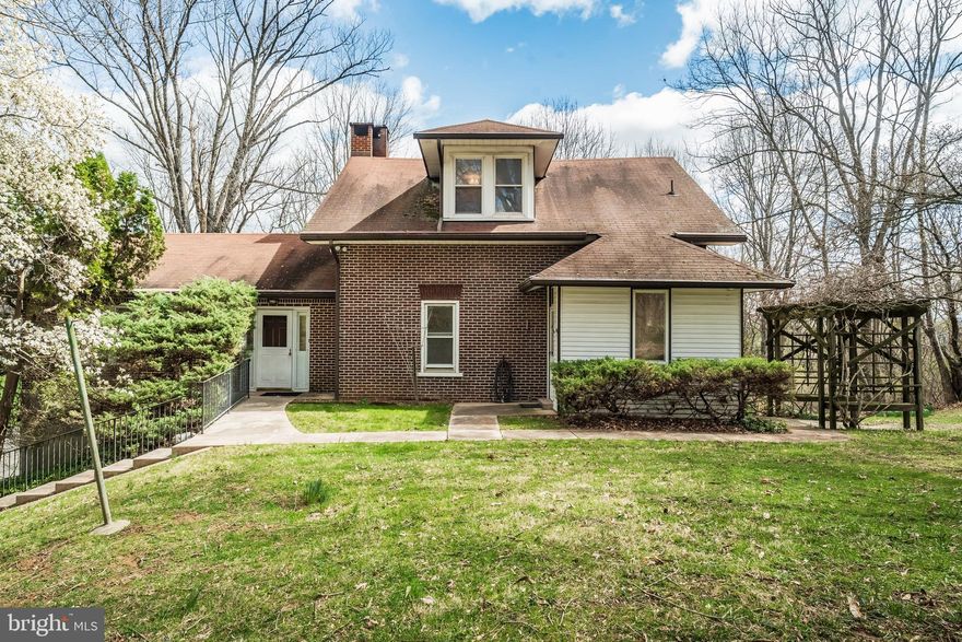 Now available in Whitehall Township, this one-of-a-kind property is tucked away on over 2 acres and in immaculate condition. A scenic ride in via the long driveway makes way to this traditional brick home, featuring gleaming hardwoods throughout, a grand family room with wood burning fireplace that includes a stone hearth and wood mantel made from trees taken from the grounds, eat-in kitchen with seating for 3, and formal dining with a beautiful view of the property. The 3-season room is an added bonus and lends a nod to the theme of the home, with beautiful wood beams overhead. Upstairs you'll find 3 spacious bedrooms, all with hardwood floors and 2 with generous walk-in closets, and a full bathroom. The full basement offers an additional 1000+ sq feet of storage/ workshop space and oversized 2 car garage with interior access. The property offers the perfect blend of seclusion and open space. Surrounded by nature, it feels like your own private retreat—where mature trees and quiet surroundings create the perfect atmosphere. Convenient to all major roadways. Proximity to shops, restaurants, schools & parks is close. Schedule today!