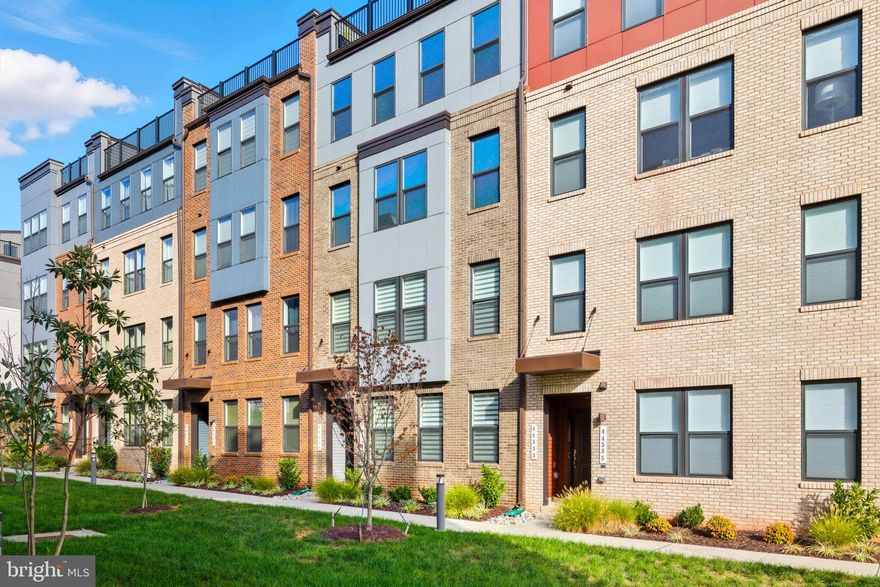 Location, location, location — just steps to ONE LOUDOUN’s dining, shopping, entertainment, and Saturday farmers market. Premium quality Stanley Martin new build (2023)  townhome with $33K in high-end Tailored Design Collection upgrades. Flexible layout with an upper-level den that can convert to a third bedroom.
The gourmet kitchen features a GE Café smart Wi-Fi appliance suite — double wall oven with precision cooking modes, large induction cooktop for fast, responsive heat, built-in microwave, French-door refrigerator with temperature-controlled zones, and ultra-quiet dishwasher — all app-controlled. MSI Carrara Marmi waterfall-edge quartz island, Sonoma Boulder soft-close cabinetry with pull-out trash bins, and a Maiolica White Gloss backsplash complete the modern design.
The primary suite includes a walk-in closet and spa-inspired ensuite bath with dual quartz vanities and an oversized heavy glass shower with full-height Orchid Atlas tile. Secondary baths feature quartz tops, designer tile, and Sterling comfort-height toilets. Additional upgrades include luxury vinyl plank flooring, plush Shaw carpet, custom closet shelving, an accessible upper-level laundry, and a fully finished, painted one-car garage with shelving and Wi-Fi opener. Spacious balcony is perfect for enjoying the outdoors at home. Zebra blinds throughout provide light control and privacy. Smart home wiring with Cat6, HDMI prewire, video doorbell, pre-wired speakers, and Kichler LED recessed lighting throughout.
 Close to Metro access, Dulles International Airport, the Washington & Old Dominion Trail, and less than 30 minutes to Tysons Corner, Capital One Hall, Wolf Trap Center for the Performing Arts, Great Falls Park, and more.