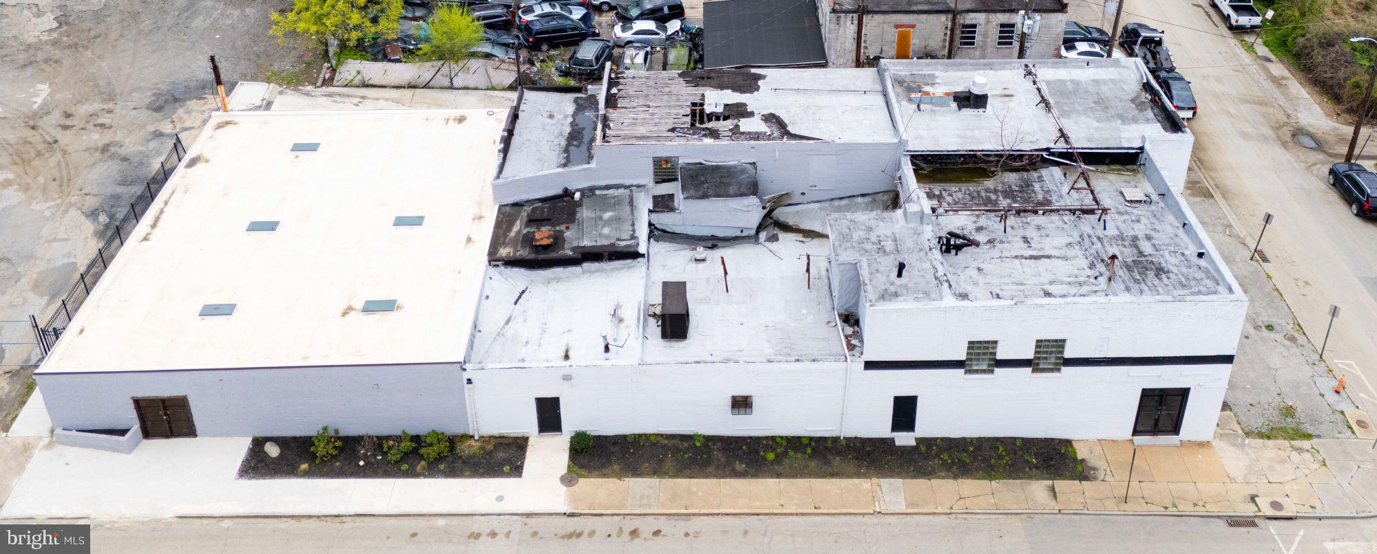 Exceptional Opportunity for Customization & Value-Add Investment. This vacant property presents significant potential for customization and value-enhancing improvements. Zoned IMU-1 (Industrial Mixed-Use) per the Baltimore City CoDeMap, it offers a wide range of permitted commercial and residential uses, making it ideal for redevelopment or adaptive reuse. Key Property Details: Lot Size: Approximately 0.195± acres (per SDAT) • Condition: Fully gutted interior with an open floor plan and partial metal stud framing in place • Improvements includes New roof, gutters, and skylights installed in 2021 (approx. $55,000+) • New stucco on the left side and rear exterior (2021, approx. $14,000) • Freshly repainted exterior brick. Loose materials and tools visible on-site are not included in the sale. Easements: Rear access through gate behind 1517 Braddish Ave to the alleyway • Driveway access between 1601 & 1603 Baker St. Location: Situated in the Coppin Heights / Ash-Co-East neighborhood of Baltimore City, with Coppin State University nearby, offering potential for community-focused redevelopment or investment. Note: All information is provided for informational purposes only. Buyers are encouraged to conduct their own due diligence to verify zoning/use allowances/actual building sq. footage.