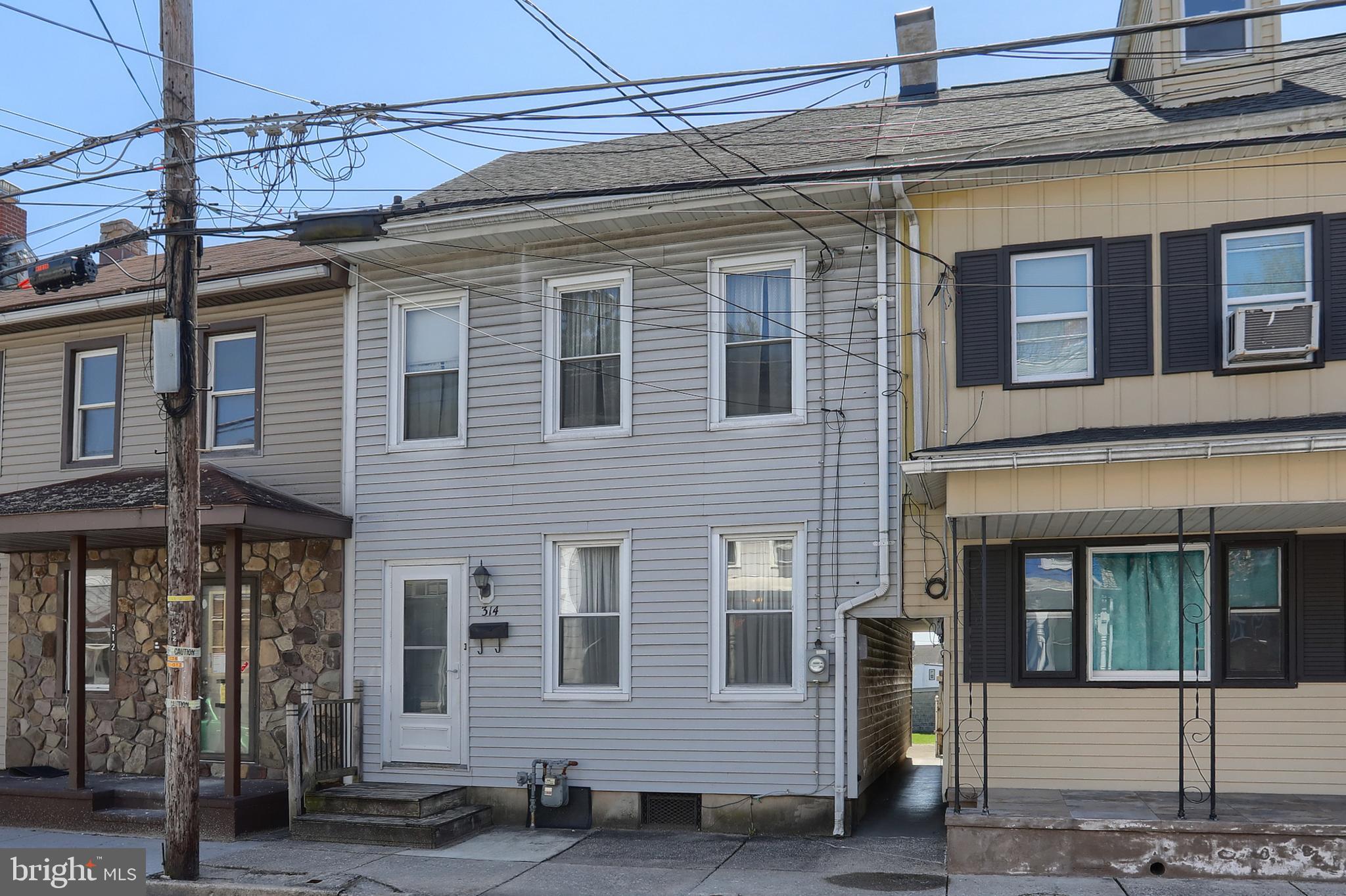 ** OFFER DEADLINE has been set for Monday, 4/13/2025 at 4pm ** This interior rowhome in Lebanon City is ready for a new owner! Offering large rooms, high ceilings – there is TONS of potential with this home! The main floor consists of a living room, dining room, kitchen, laundry area and a full bathroom. On the second floor, you’ll find 3 hall-entered bedrooms and a 2nd full bathroom. There is a walk-up attic that offers extra storage space. The covered back porch and low maintenance back yard offer a FUN place to gather with family and friends for outdoor enjoyment. The unfinished basement offers additional storage space. There is an oversized detached garage, which previously served as a carpentry shop. Accepting Cash or Conventional offers only! This home is a definite must-see! Schedule your showing today!