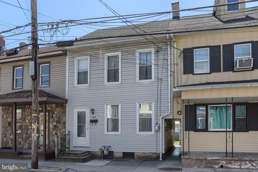 ** OFFER DEADLINE has been set for Monday, 4/13/2025 at 4pm ** This interior rowhome in Lebanon City is ready for a new owner!   Offering large rooms, high ceilings – there is TONS of potential with this home!  The main floor consists of a living room, dining room, kitchen, laundry area and a full bathroom.  On the second floor, you’ll find 3 hall-entered bedrooms and a 2nd full bathroom.  There is a walk-up attic that offers extra storage space. The covered back porch and low maintenance back yard offer a FUN place to gather with family and friends for outdoor enjoyment. The unfinished basement offers additional storage space.  There is an oversized detached garage, which previously served as a carpentry shop.  Accepting Cash or Conventional offers only! This home is a definite must-see! Schedule your showing today!