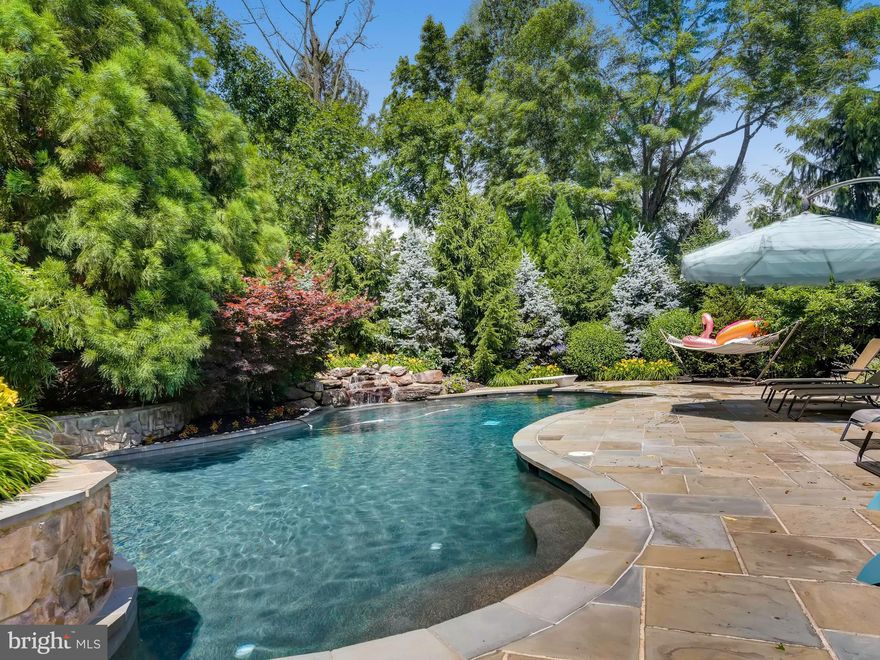 Resort style vacation living in the Hereford Zone! 4 full ensuite bedrooms. Thoughtful attention to quality detail through out,    Main floor features  extravagant foyer, living, dining, office,spacious  family room, sun room and gourmet kitchen. The outdoor features beckon a sophisticated yet casual lifestyle. Multi-tiered stone patios with outdoor kitchen, grill, fireplace, hot tub and a luxurious lagoon style saltwater heated pool with with pebble finish and waterfalls. The mature landscaping offers privacy and an escape to vacation like lifestyle.In addition through a gate there is a large grassy field area to play, walk the dog, or throw a frisbee. Finished mostly above grade full basement with double walkout, windows and full bath. Abundance of storage and possibilities in the unfinished area. Room for a 5th bedroom and a movie or gym room   This home offers terrific flow for entertaining, and features many multiple gathering and many private spaces for quiet.    Welcoming dramatic  foyer with twin curved stairways, chandelier and palladian window. Spacious living and dining rooms offer tray ceilings extensive molding and hardwood floors. The first floor office is private with french door entry, a wall of built in shelving and cabinetry, and windows with view of the rear patios. The two story family room with a coffered ceiling, fan, and recessed lighting  has a rear staircase to the bedroom level. The warming gas fireplace, windows to the rear patio and outdoor kitchen, make this a great room for relaxation.   The recently updated  gourmet kitchen is a chef's delight. Plenty of room to chop & dice, create and gather. Lots of table and counter space, a bar with wine frig, and pantry. Massive granite island, double drawer dishwasher, french door frig, and granite sink. Cook while you chat with those in the adjoining sunroom.The laundry and mudroom are accessed from the 3 car garage and feature new  granite folding table, sink and cabinets.     Bedroom level   All rooms are generously sized, and with a full bath.  The Master suite boasts a newly renovated bath that is luxurious beyond compare. Heated tile floor, and warming towel racks on timers, a Neptune air tub, walk in shower with 3 shower head options, pebble stone wall & floor, and a stacked stone island with cabinetry and drawers, perfect for packing a suitcase. The vanities have pounded copper sinks, lighted mirrors and soft close drawers with electric built in for maximum convenience. Gigantic His and extravagant Hers locking walk in closets with proper built in shelving, and drawers.  All the other bedrooms feature Chesapeake closet systems, fun tile combinations, cabinets and beautiful vanities.There is also  a true hall linen closet with labelled shelving.    The finished lower level is above grade allowing plenty of light with windows to the side and rear yard with  a double walk out. Many opportunities in LL for a 5th bedroom.  There is a full bath, and enormous unfinished  storage area which could easily become a movie media room or gym. This home has been well maintained and upgraded in a recent remodel.     Some of the newer upgrades include: New 2nd level HVAC unit,oversized hot water heater, water treatment systems, well pump, sump pump, exterior halogen security motion activated lighting and pool fencing. This home will be the gathering place for all your family and friends.