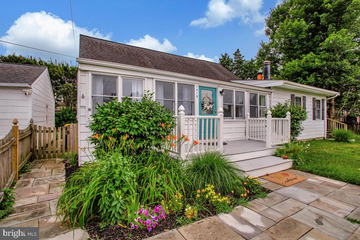 PRICE REDUCTION: Discover coastal living in this charming 3-bedroom, 2-bath home nestled in the sought-after private community of Shoreham Beach. Situated on a peaceful peninsula, this unique neighborhood has been cherished since 1932 and offers a rare blend of history, charm, and waterfront amenities. Enjoy exclusive access to a private beach, private crabbing dock, and a private boat ramp—all just steps from your door.
Inside, the home features hardwood flooring, recessed lighting, granite countertops, and a cozy wood-burning fireplace. The layout offers spacious living with great natural light and thoughtful updates throughout. The walk-up attic provides excellent storage or potential for additional living space. Outside, the fully fenced yard offers privacy and room to relax or entertain on the large deck. A detached garage and extended driveway provide plenty of parking—even room for your boat!
With no HOA fees (included in your property taxes), this property offers convenience and value. Whether you're launching your kayak, fishing from the pier, or simply soaking up the Bay breeze on the beachfront deck, this is coastal living at its best—where every day feels like a getaway. New well installed 7/2024.