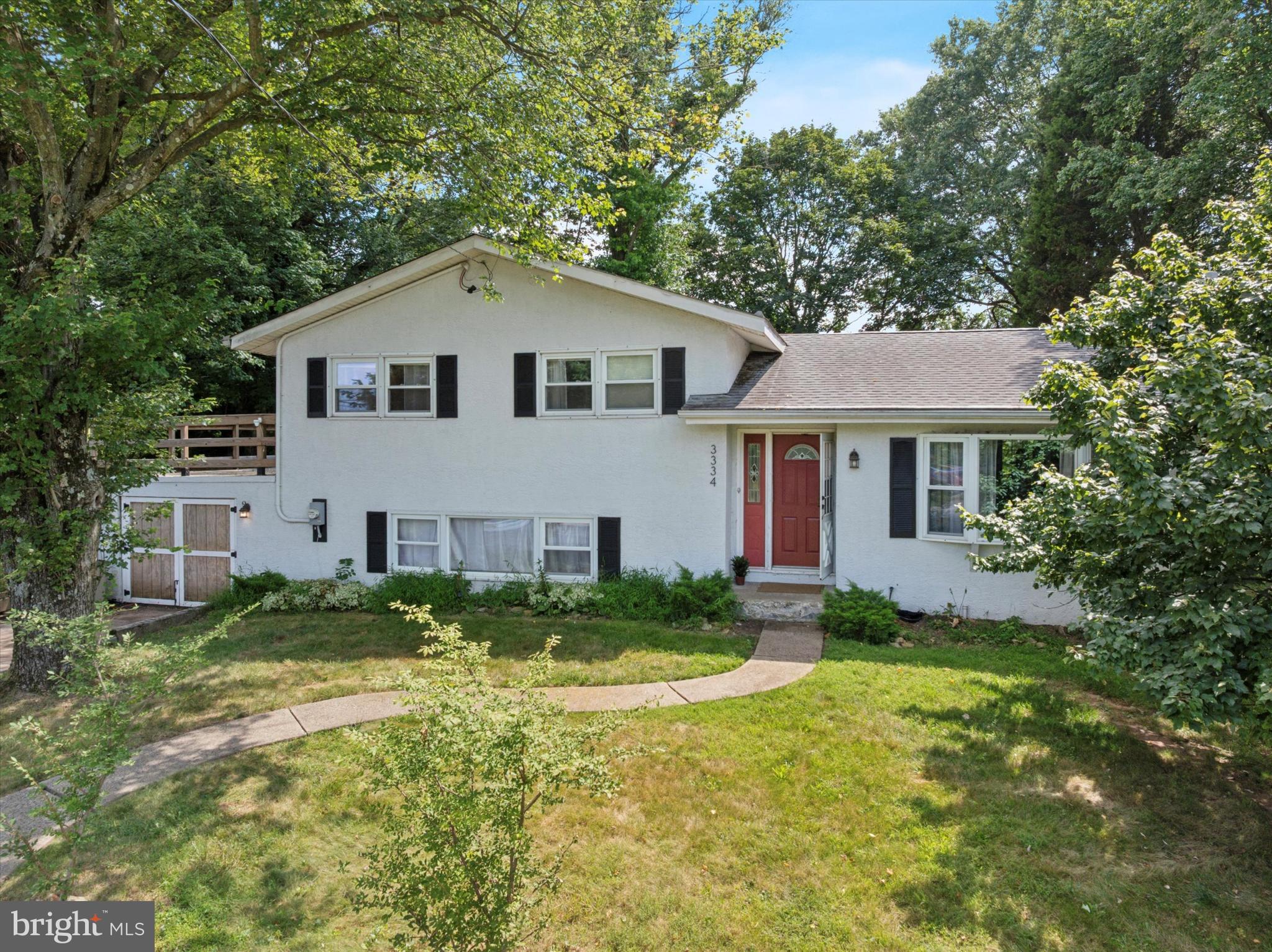 Welcome to 3334 Germantown Pike, a charming home nestled on a sprawling 1.37-acre corner lot in the heart of Collegeville. This property uniquely combines space, privacy, and opportunity—ideal for those looking to settle in or explore the many possibilities the land offers.
Set back from the road, the home features 1,820 square feet of well-designed living space across three levels. The main floor offers an open-concept layout with hardwood floors and a spacious kitchen equipped with stainless steel appliances and a gas stove. Adjacent to the kitchen, the inviting living room is anchored by a cozy wood-burning fireplace.
Upstairs, three generously sized bedrooms share a full bathroom accessible from both the hallway and the primary bedroom. A private balcony off the primary bedroom overlooks the expansive yard, providing a peaceful spot for morning coffee. The finished lower level includes a half bath, laundry area, and bonus space ideal for a home office, playroom, or gym, with convenient access to the garage.
Situated on a prominent corner lot, the property provides ample room for outdoor living, gardening, and potential expansion. There is space to add additional structures such as a guest house, workshop, or recreational features like a pool or tennis court (subject to township approval), enhancing functionality and increasing adaptability over time. Two garages—one attached and one detached—offer excellent storage or workspace options. Recent upgrades including a dual-system HVAC with an efficient and flexible gas option, and a newer water pump (2023).
The generous acreage presents significant potential for expansion and development, making this a practical and strategic opportunity for growth and personalization—enhancing your living space while securing long-term value. Located in Collegeville, the home provides access to the Methacton School District, convenient shopping and dining, the Perkiomen Trail, Evansburg State Park, and more.