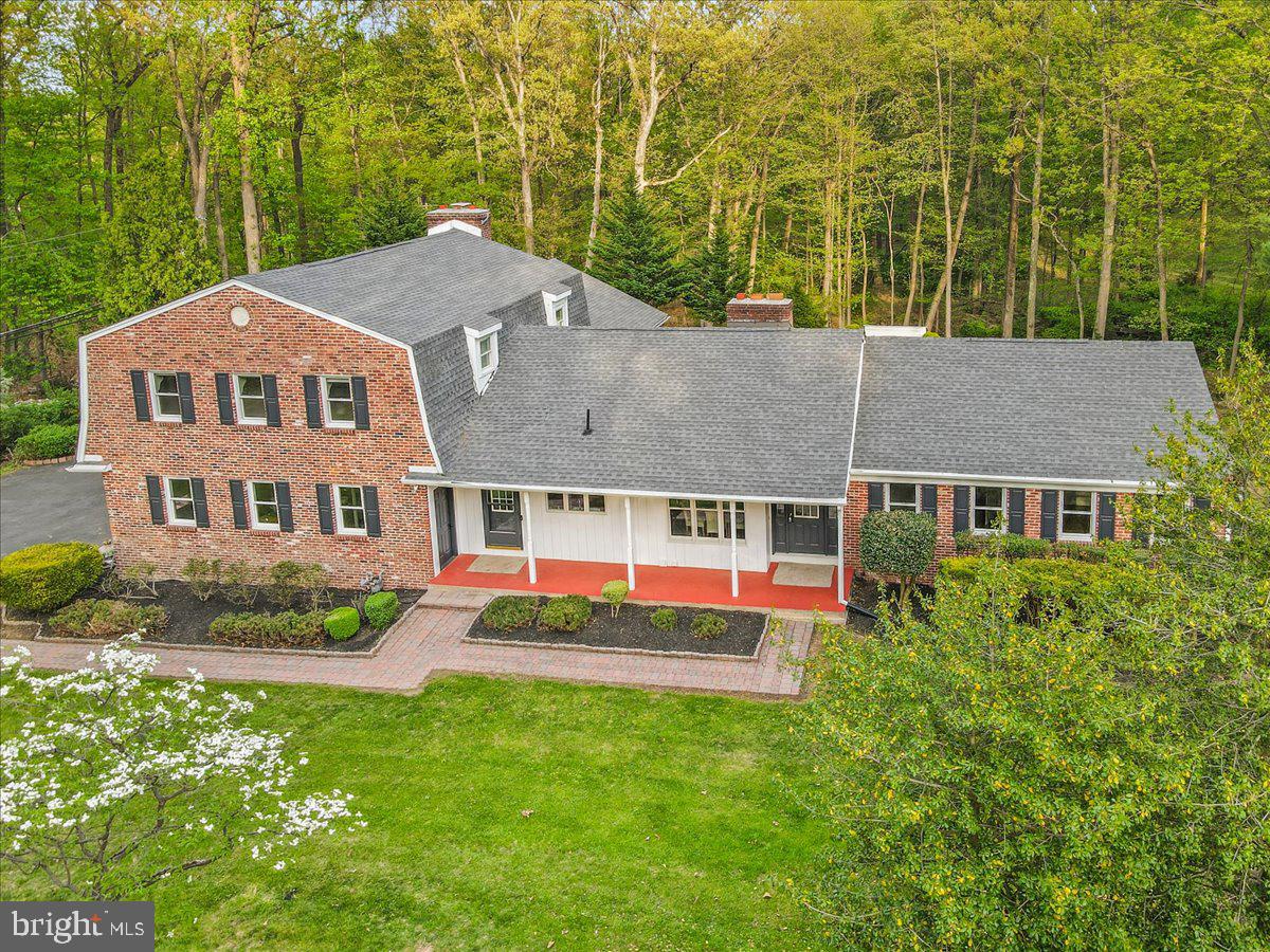 Deceptively Modest. Impressively Spacious.
This 5 bedroom, 5 full, 2 half bath home on Valley Forge Mountain offers over 6,000 sqft of flexible living space on 1.35 wooded acres- perfect for guests and remote work.
The first floor features 3 bedrooms, 2.5 baths, a formal living room, dining room, sun room, and massive family room with skylights and a cozy office space. The updated eat in kitchen includes radiant heated tile flooring, a double oven, gas cooktop, microwave, dishwasher and refrigerator. A large island, pantry cupboard and numerous wall cupboards provide excellent storage space.
The master suite composes the entire second floor. It includes a sitting room, bedroom, 2 full bathrooms, and a huge walk-in closet with built in shelving.
The walkout lower level opens to a brick patio and fenced backyard. It includes a bedroom and full bath, suitable for guests, parents, or nanny. The laundry room includes the washer and dryer with built in shelving. The boiler room is also off the laundry room. An additional room is suitable for a workshop. The remainder of the floor offers space for a home gym, pool table, ping pong table or maybe all three. A second boiler room with its own outside entrance has a second heater and on demand tankless water heater. It has a half bath and additional storage area.
Practical upgrades include: two heating zoned (6 zones) heating systems, two hot water heaters including one on-demand tankless heater, and 2 new central air conditioning units, a new septic system, and a 5 year old roof. Includes an attached oversized two car garage.
Located in the Phoenixville Area School District, this home offers optional membership in the Valley Forge Mountain Association. The association is a social group that maintains the tennis courts, swim club, and recently upgraded playground and picnic area. The area is just a short walk away.