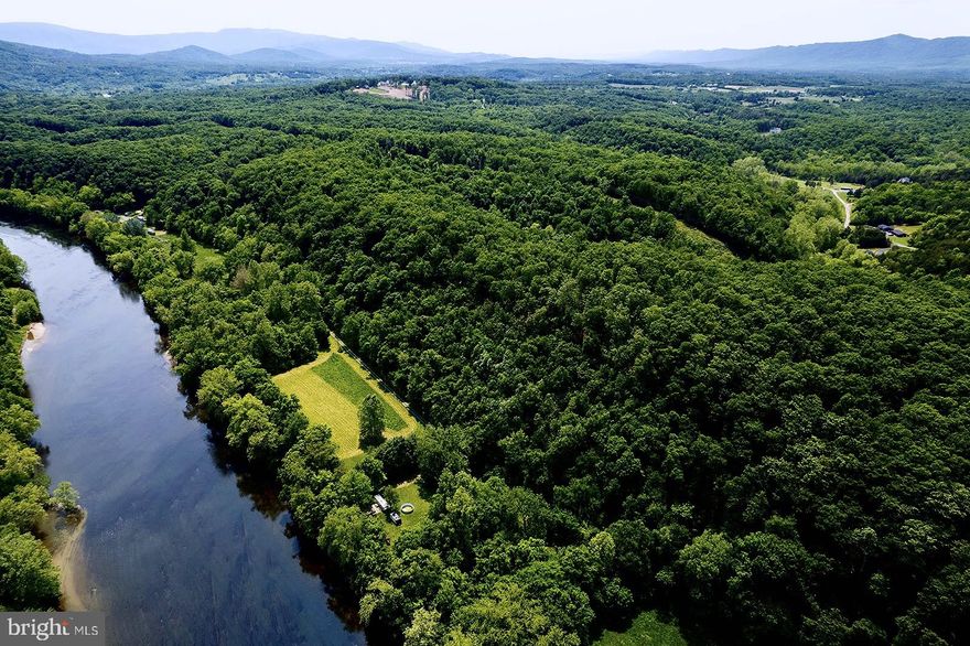 With breathtaking views of the river and mountains, this expansive 203-acre estate offers ample land, utmost privacy, and a sense of seclusion. Despite its tranquil surroundings, this property remains conveniently situated near downtown Front Royal, as well as Interstates 66 and 81, making it an ideal location for commuters. Whether you aspire to construct your dream home, establish a family retreat, or embark on a development project, the possibilities are endless on this remarkable property. Brimming with abundant wildlife, lush foliage, and the potential for river and mountain views from numerous lots, this oasis is truly a paradise for nature enthusiasts. Encompassing multiple 4x4 trails, dirt roads, and walking paths, it allows you to fully immerse yourself in the elevated wooded wilderness. Comprising of five distinct parcels zoned for agriculture and residential use, the property offers limitless customization opportunities. A builder or developer would find this property to be an exceptional investment. Provided that the criteria for variance are met (see documents), there is potential approval for 53 single family homes. Additionally, a well and septic system currently serve the tenant-occupied rental house near the entrance gates, and the house will be conveyed as-is.