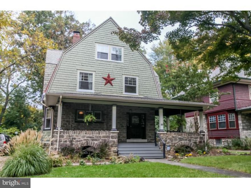 If you love older homes with original architectural details, then don't miss seeing 11 E. Greenwood Avenue! This charming Dutch Colonial Revival home brings back memories of a by-gone era. The inviting, large wrap-around porch welcomes friends and neighbors into the gracious center hall entryway. Generously-sized living room features beautiful original architectural details such as built-in bookcases, stained glass windows, Mercer tile fireplace with stove insert and exposed beam ceiling. The Formal dining room has a lovely, original built-in china cupboard. Kitchen offers updated stainless appliances & brand new flooring, adjacent to a powder room and mudroom.  Walk out to huge, level rear yard with shade trees and beautiful perennial gardens. The 2nd floor boasts a Master bedroom with custom closet installation, two additional bedrooms and a hall bath with a claw foot tub and subway tile. On the 3rd floor you'll find two more bedrooms and a large, updated bath. Just a short walk to the R3 Septa train station and everything else this 'Classic Town' has to offer: seasonal outdoor Farmer's Market, Lansdowne Symphony, Folk Club, Art Festivals, historic Lansdowne Theatre (slated for restoration), Regency Cafe, Avenue Deli, Sycamore & more. Easy access to Center City Philadelphia.  Become part of this terrific community today!