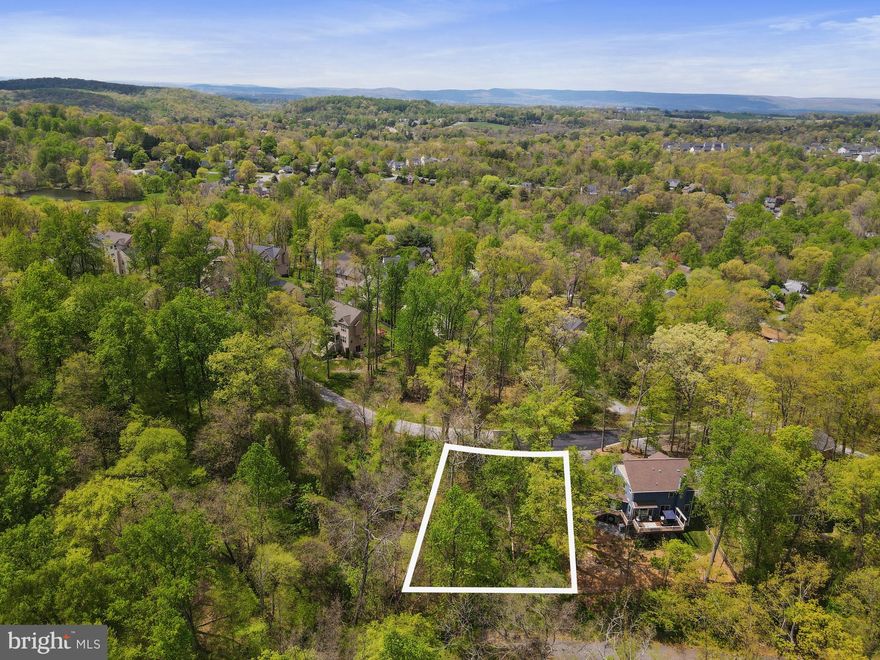 Don't miss this wonderful opportunity to build on a vacant wooded lot with utilities already in place in the sought after community of Lake Linganore. Enjoy all that the community has to offer with deep navigable lake, sandy beaches, pools, boating, fishing, swimming, tennis, basketball, beach volleyball, nature & bike trails, kayaking, Frisbee golf, pickleball, playgrounds and so much more. Buyer to assume outstanding benefit assessment to pay for the water and sewer installation.