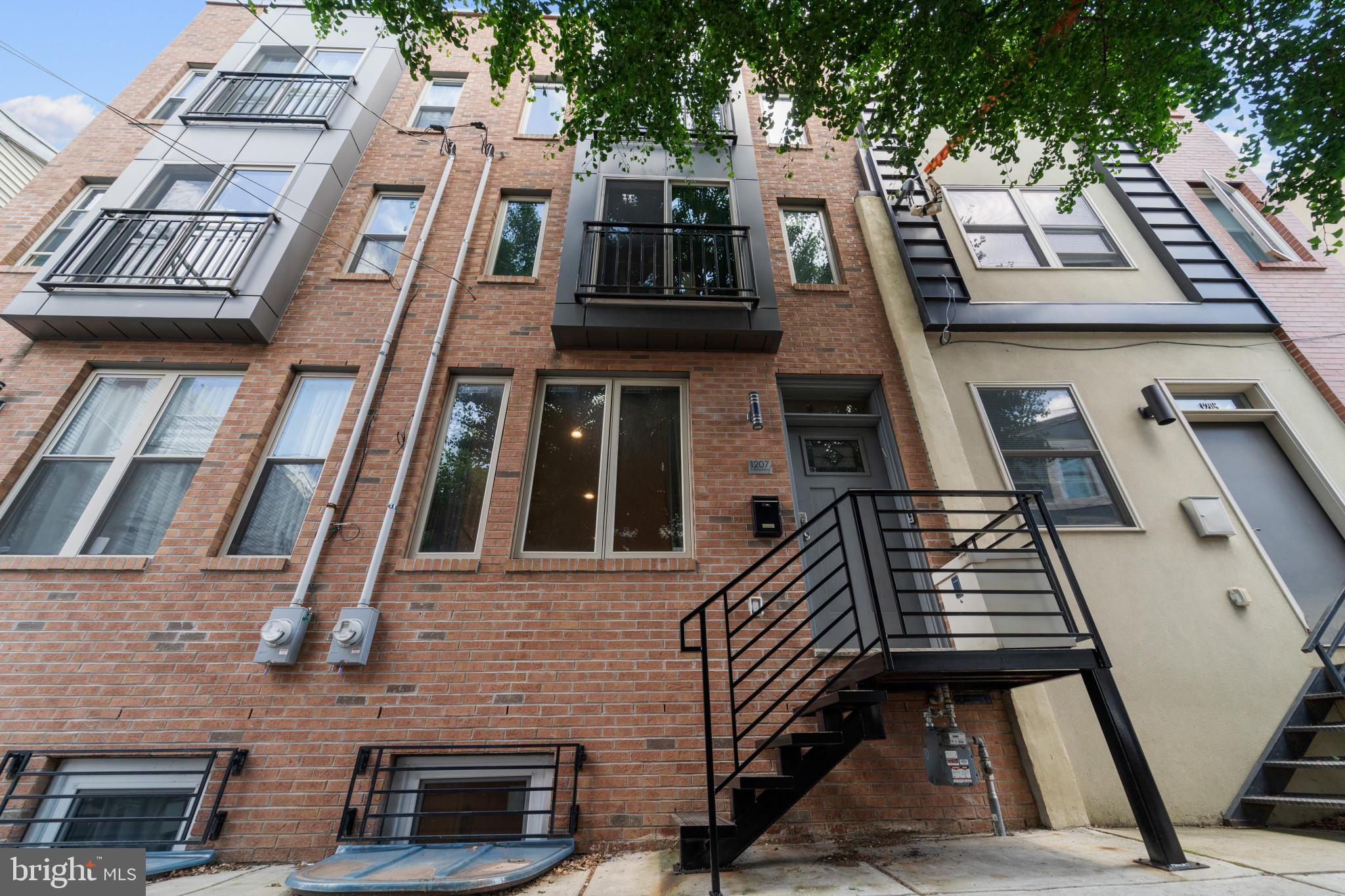 Welcome to urban luxury in this beautiful row home in the vibrant and bustling neighborhood of Fishtown. Meant to be a forever home, the current owner bought this plot of land and built the property from the ground up with meticulous attention to detail, style and quality. Unlike many other new constructions meant to turn a quick profit, the current owner built this dream house with the intention of living in it for years to come but had to relocate for work and family. At the entrance, you will see a well-equipped foyer with coat closet. Open the next door into an open floor plan with high end hardwood floors (present through 1st, 2nd and 3rd floor). The unique kitchen includes high end quartz countertops with matching backsplash, custom high end lighting and stainless steel appliances. Further back, a fenced backyard creates the perfect space to grill and relax outdoors. Downstairs, you will notice a finished basement with vinyl flooring and a full bathroom. Walk up to the second floor to find two bedrooms, another full bathroom, and a sizeable laundry room. As you walk up, this rowhome only continues to impress with the master bedroom with a beautiful view of the city through a Juliette balcony. The tiled master bathroom includes a sprawling shower and a luxurious double sink vanity - all with high quality fixtures. The master bedroom suite also includes a kitchenette conveniently located on route to the rooftop which includes gorgeous city views where you will be able to entertain guests for hours. All of this is located just steps away from some of Philadelphia’s most highly rated restaurants, cafes, entertainment venues, and conveniently accessible to public transportation. Also, the cherry on top, this house has 5 years left on a 10 yr tax abatement on improvements. Do not miss out on this gem in the heart of Fishtown!