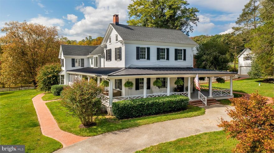 Quietly tucked away down a long winding driveway sits this picturesque farmhouse compound circa 1852 on 23 acres. Lovingly updated and preserved throughout the years, you are greeted by a beautiful wrap-around porch, brick paver walkway, and sweeping pastoral views. Modern updates throughout. There is a cozy family room, a large butler’s pantry, wrapped beams in the dining room, and a glorious screened-in porch. Two primary suites, one upstairs and one with freshly finished final renovations on the first floor with an added wall of windows, two large walk-in closets, and a completely remodeled bathroom. The home offers exposed beams, brick floors, and modern touches throughout. Two attic spaces, one easily finished with full walk-up stairs for any additional needs.

This property has everyone’s wish list. There are multiple usable outbuildings. The original smokehouse/wine cellar. A perfect separate office in its own building with a large pot belly stove. Two garages with 6 total bays.  Both have plenty of workspaces, a workshop and additional storage. There is a large stocked pond with a dock, postcard-worthy silos, and a completely revitalized tenant house. The bank barn was a million dollar build back by using an existing historic barn that was moved to this new location. Careful attention was paid to every detail, keeping the barn historically accurate and fully functional. There are 11 stalls and 5 paddocks, all with frost-free spigots and electric outlets to easily de-ice troughs in the winter.

The current owner has substantially improved the property by replacing almost all major systems to full renovations of most rooms. All buildings have been reroofed, replaced most HVAC systems, new gutters, newer pool equipment, heater, and cover. 2 new wells were also installed to service the tenant house and the barn.  High-speed Comcast has already been run up the driveway, so working from home is a breeze. Renovated bathrooms and kitchen, butler’s pantry, and additional pool bath also added so guests have a place to change without wet feet walking through your home.
New 100k bridge, new SimpliSafe security system, and a bell to alert you when your guests arrive. A full list of upgrades is available.
The tenant house was restored from top to bottom and features 2 large bedrooms and a full bath.  The kitchen has concrete countertops, half bath, laundry, and plenty of cabinet space. The tenant house and the barn have current tenants if you want to purchase and have instant income monthly income.
All of this with the most convenient Monkton location, minutes to 83 and ten minutes to Hunt Valley shopping.  The list goes on.  Please join us for the Broker’s Open 10/25 1-3.