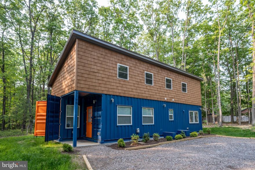 Welcome to Contain Yourself, a truly one-of-a-kind container home in the heart of Deep Creek Lake! This thoughtfully designed 2-bedroom, 1.5-bath retreat blends modern style with cozy comfort and is currently operating as a successful vacation rental. Conveniently located just minutes from Deep Creek Lake State Park, this property offers easy access to hiking, swimming, boating, and all the area’s year-round recreation. The home features a creative layout with open living space, contemporary finishes, and unique architectural details that set it apart from anything else on the market. Whether you’re searching for a turn-key investment, a weekend getaway, or a full-time residence with personality, this property delivers both charm and income potential.
