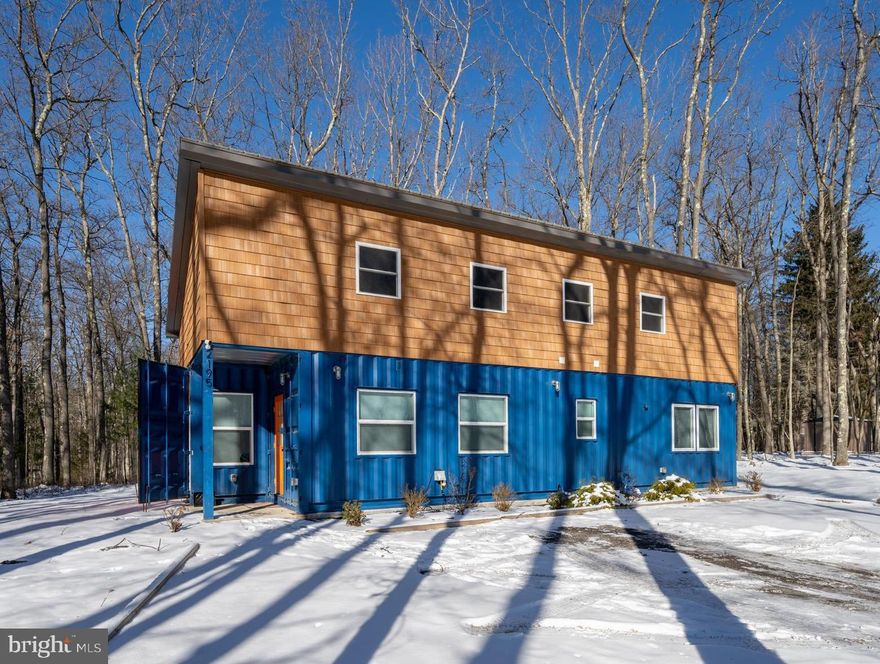 Welcome to Contain Yourself, a truly one-of-a-kind container home in the heart of Deep Creek Lake! This thoughtfully designed 2-bedroom, 1.5-bath retreat blends modern style with cozy comfort and is currently operating as a successful vacation rental. Conveniently located just minutes from Deep Creek Lake State Park, this property offers easy access to hiking, swimming, boating, and all the area’s year-round recreation. The home features a creative layout with open living space, contemporary finishes, and unique architectural details that set it apart from anything else on the market. Whether you’re searching for a turn-key investment, a weekend getaway, or a full-time residence with personality, this property delivers both charm and income potential.