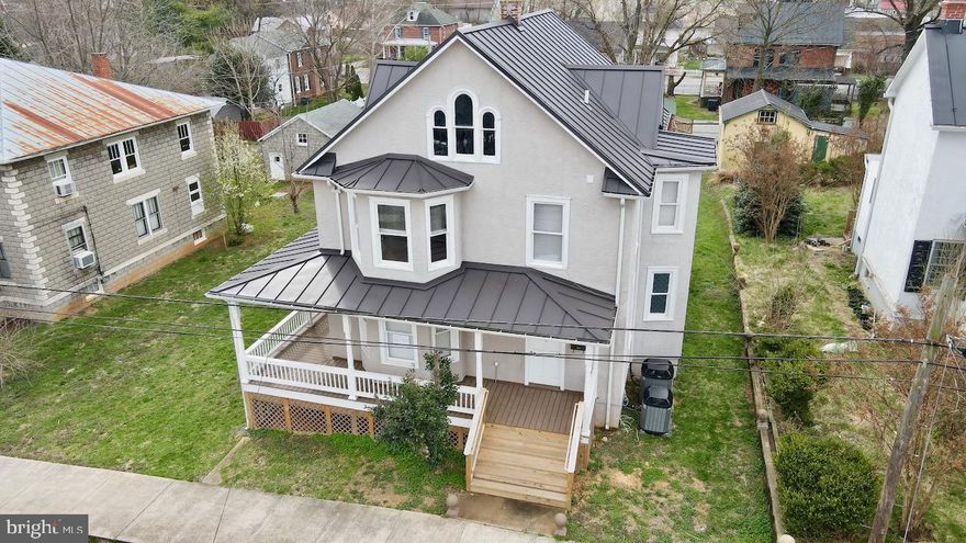 Nicely renovated Colonial in downtown Ranson/Charles Town Area within walking distance to shops, dining, and more! This 4-level home, built on a double lot, features 3 Bedrooms, 2.5 Baths, original hardwoods under carpet. Brand new GE Profile Cooking-range and Refrigerator in the kitchen. NEW dual-zone Trane HVAC with smart Thermostats that can be connected to WiFi, including a two-year warranty! Brand new high efficiency Tankless Water Heater is installed. Completely renovated and improved wrap around porch. New metal roof in 2018. Attic is floored and renovated. Basement is renovated with 4” new concrete floor and vapor-barrier. Double lot creating a spacious backyard to enjoy! X-finity high speed internet service is available. Close to Hospital and Hollywood Casino/Charles Town Race Track.