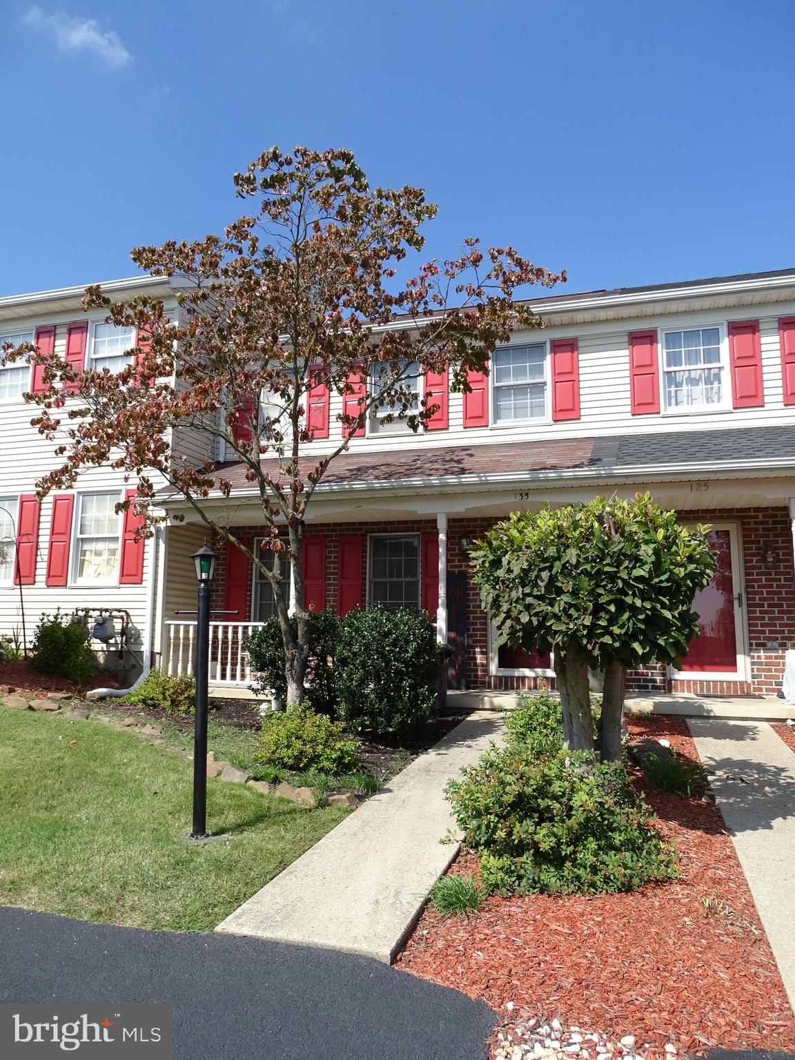 Located Minutes from Rt-30 and I-83 this Woodmont Estates Town House is priced to sell!!! This Home features off street parking for 2 cars side by side, a covered front porch, a deck out back, and mature landscaping.  Entering the home you will be greeted by a large Living Room, followed by a large Country kitchen with all appliances, ceramic tile floor, and a french door to the back deck.  Off of the kitchen you will find a half bath with ceramic tile floor.  Ascending to the 2nd floor you will find to large bedrooms. The back bedroom features double closets.  The front bedroom has a walk in closet.  There is also a full bath with double bowel vanity!!!  Full Basement with Laundry hookup, Gas FHA, CAC, Gas H2O heater.  Front door and shutters were just painted to match HOA guidelines.    This home needs paint and carpet.  It is priced accordingly.